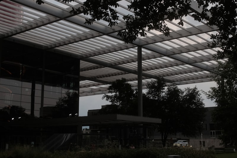 Modern building with a large, sloped roof.