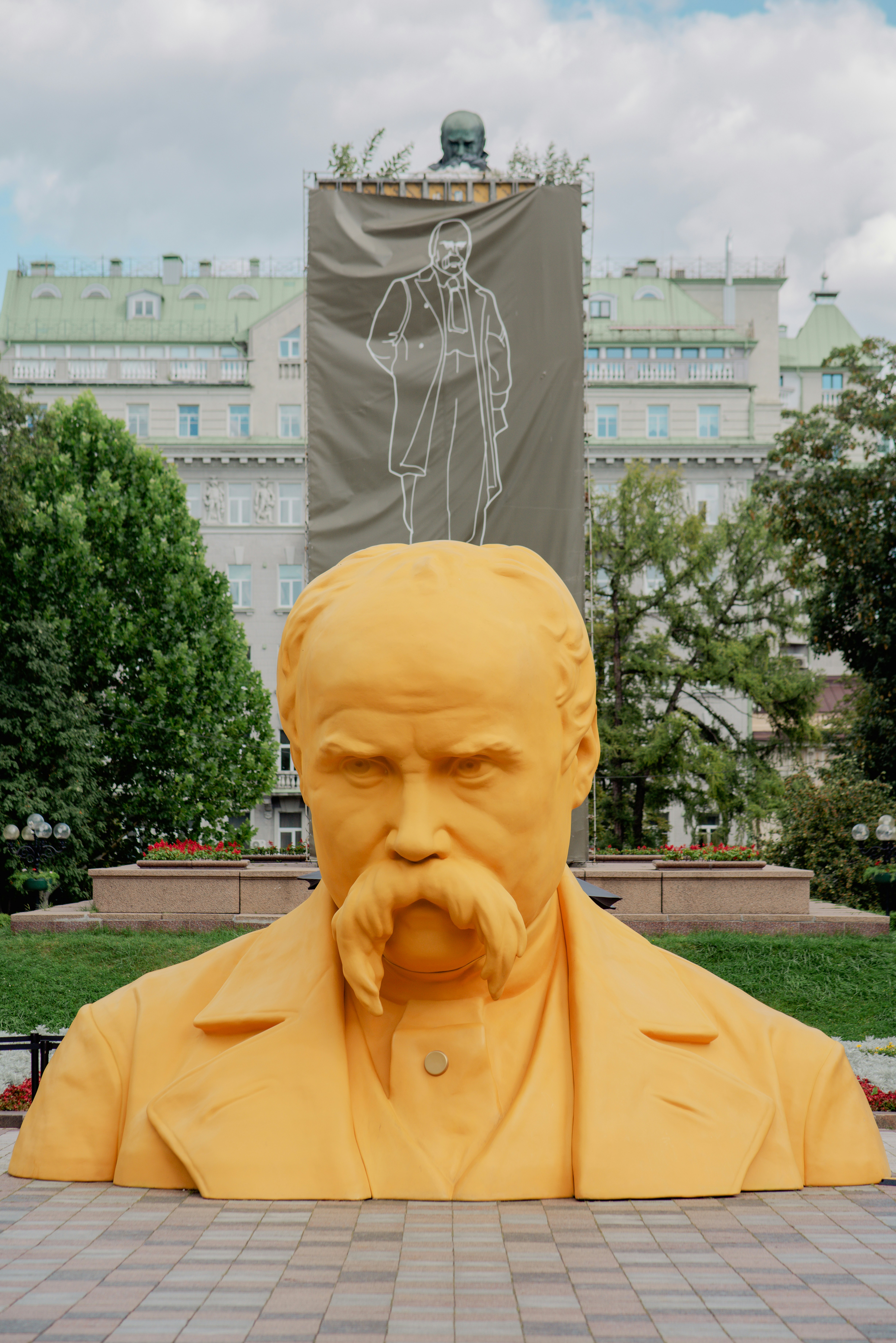 Orange statue of a man with a mustache