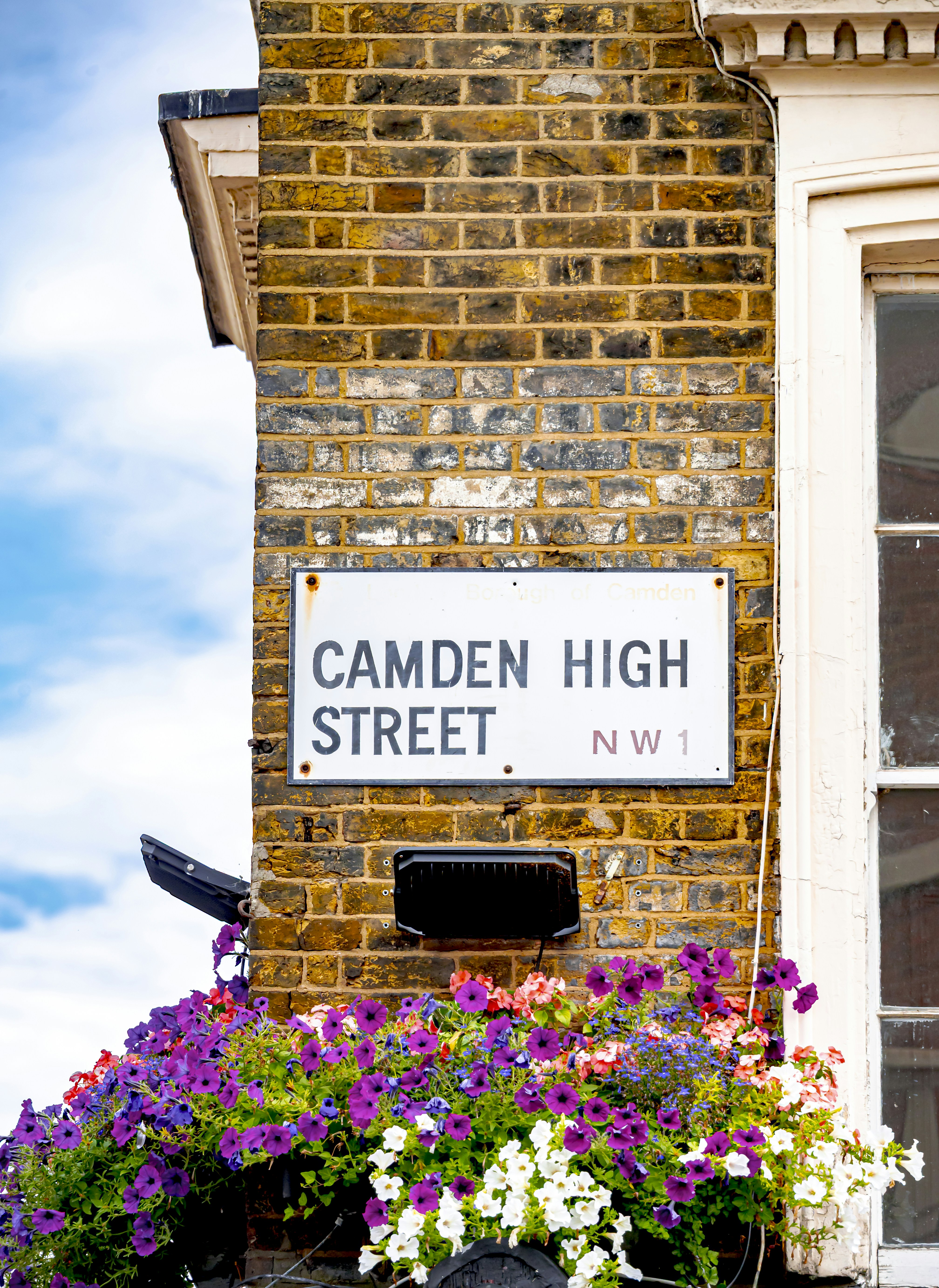 Camden high street sign with flowers photo – Free Art Image on Unsplash