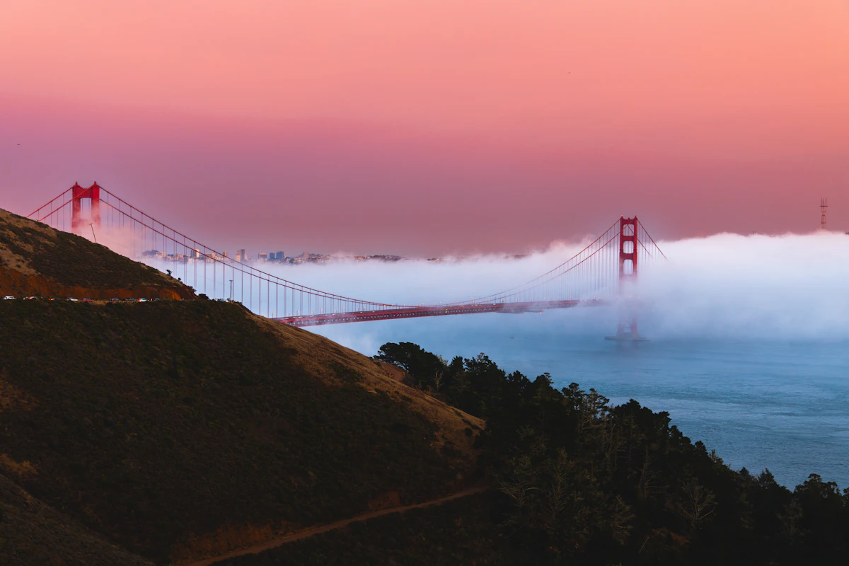 Golden Gate Bridge appearing through soft San Francisco fog