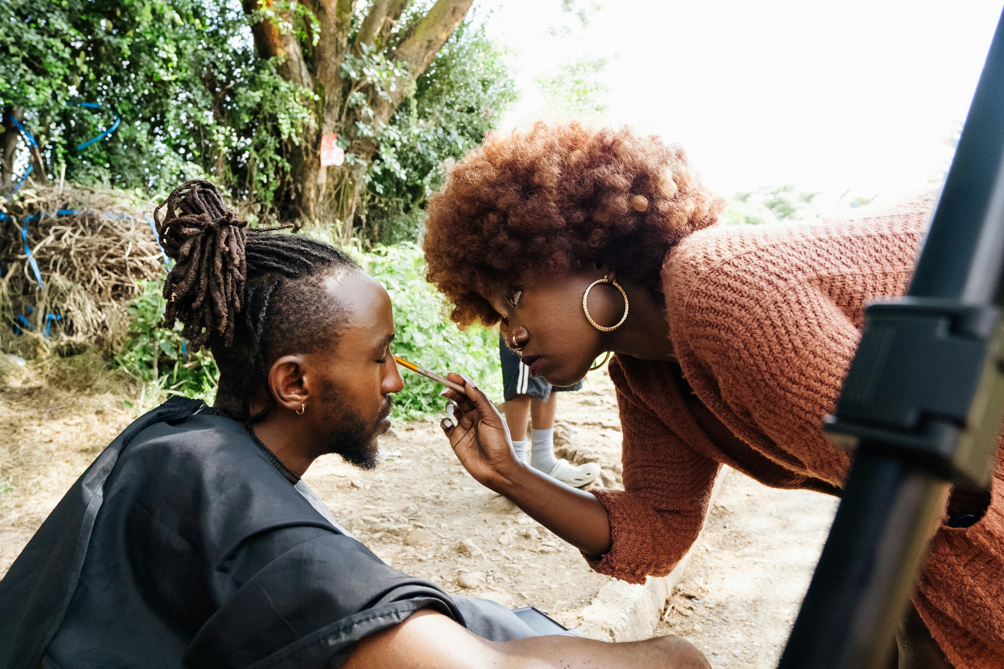 Two people looking at each other outdoors