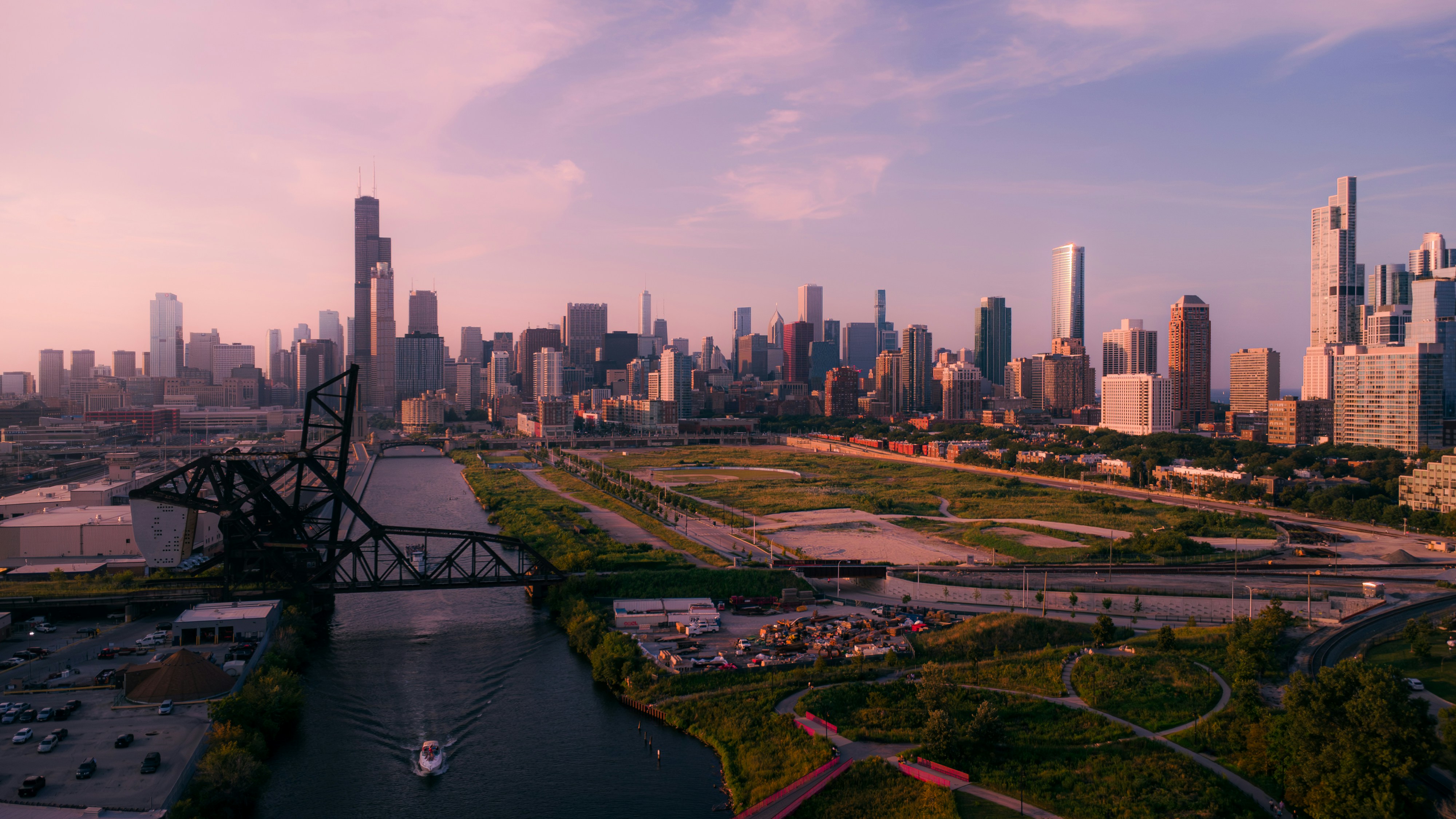 City skyline with skyscrapers and green park area.