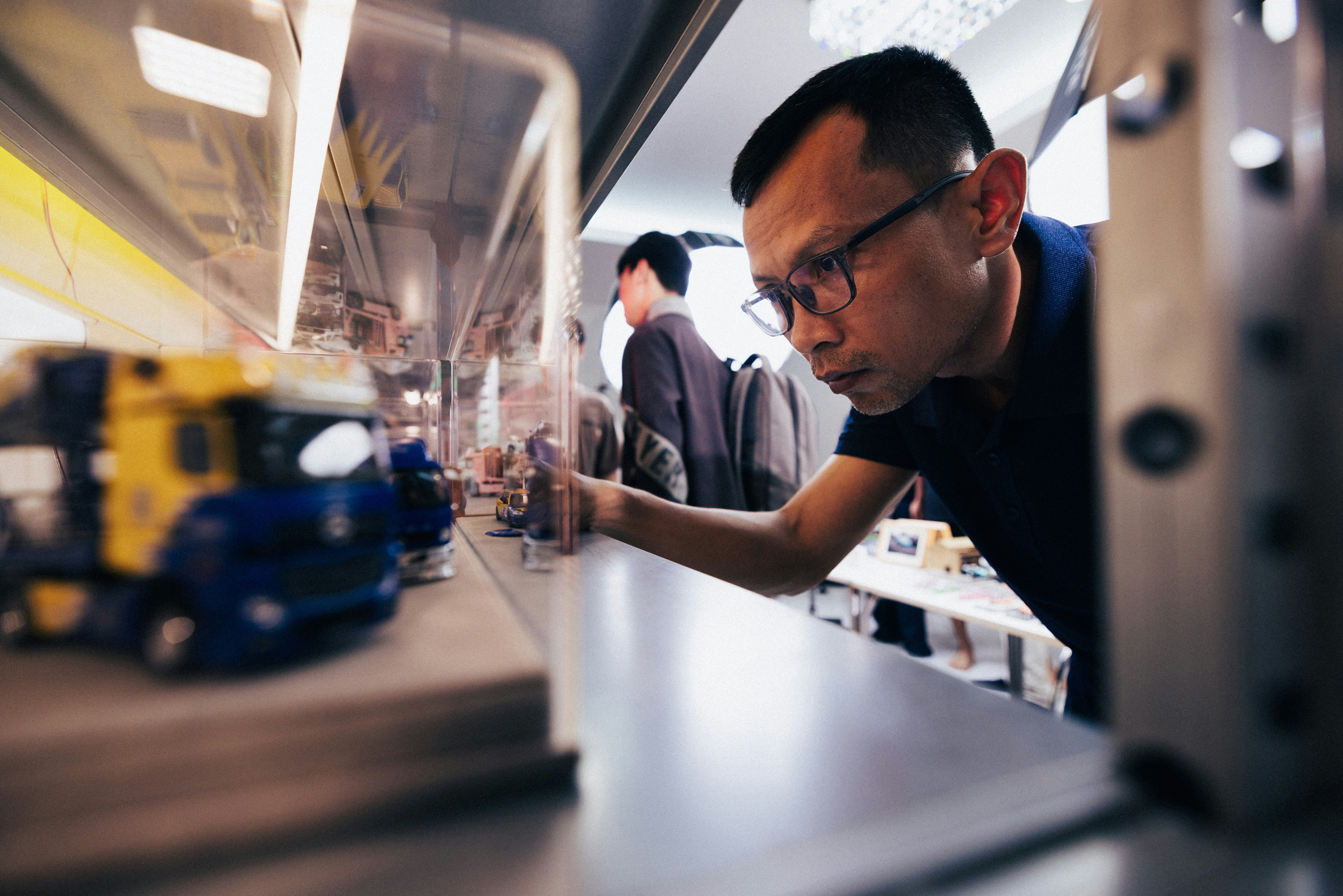 Man in glasses working in a factory