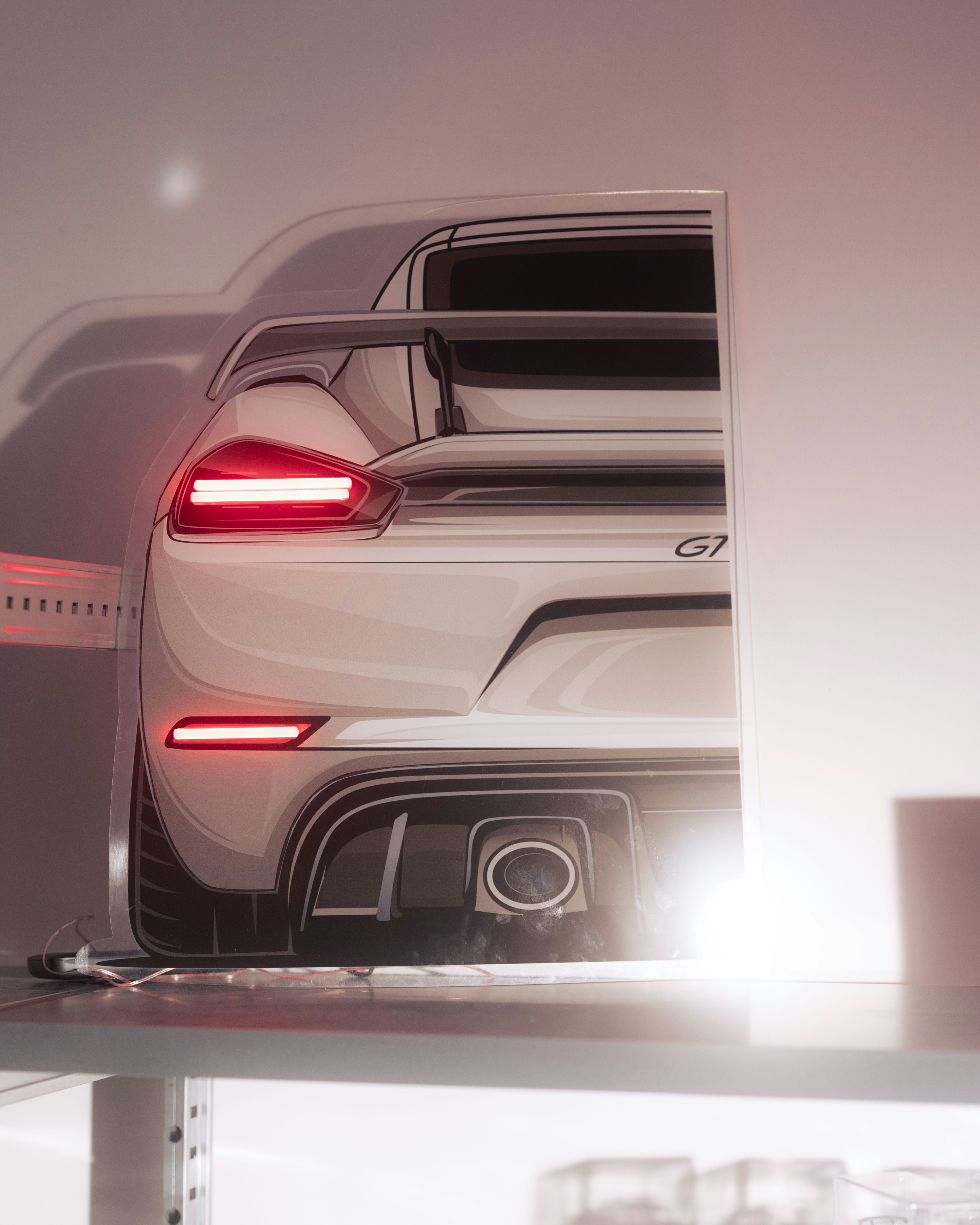 White sports car with illuminated taillights