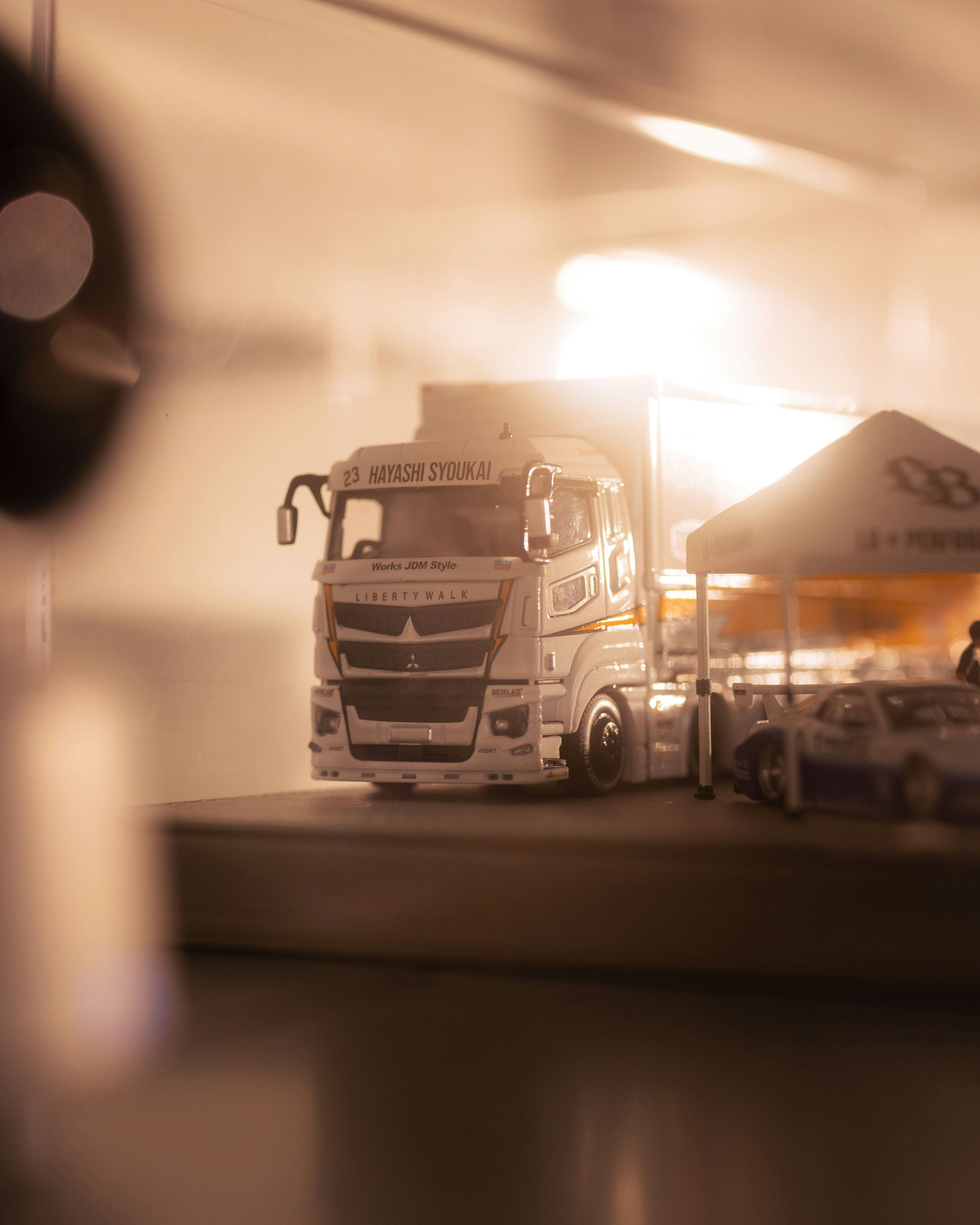 White truck parked under a bright sun.