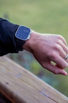 Person checking time on a smartwatch