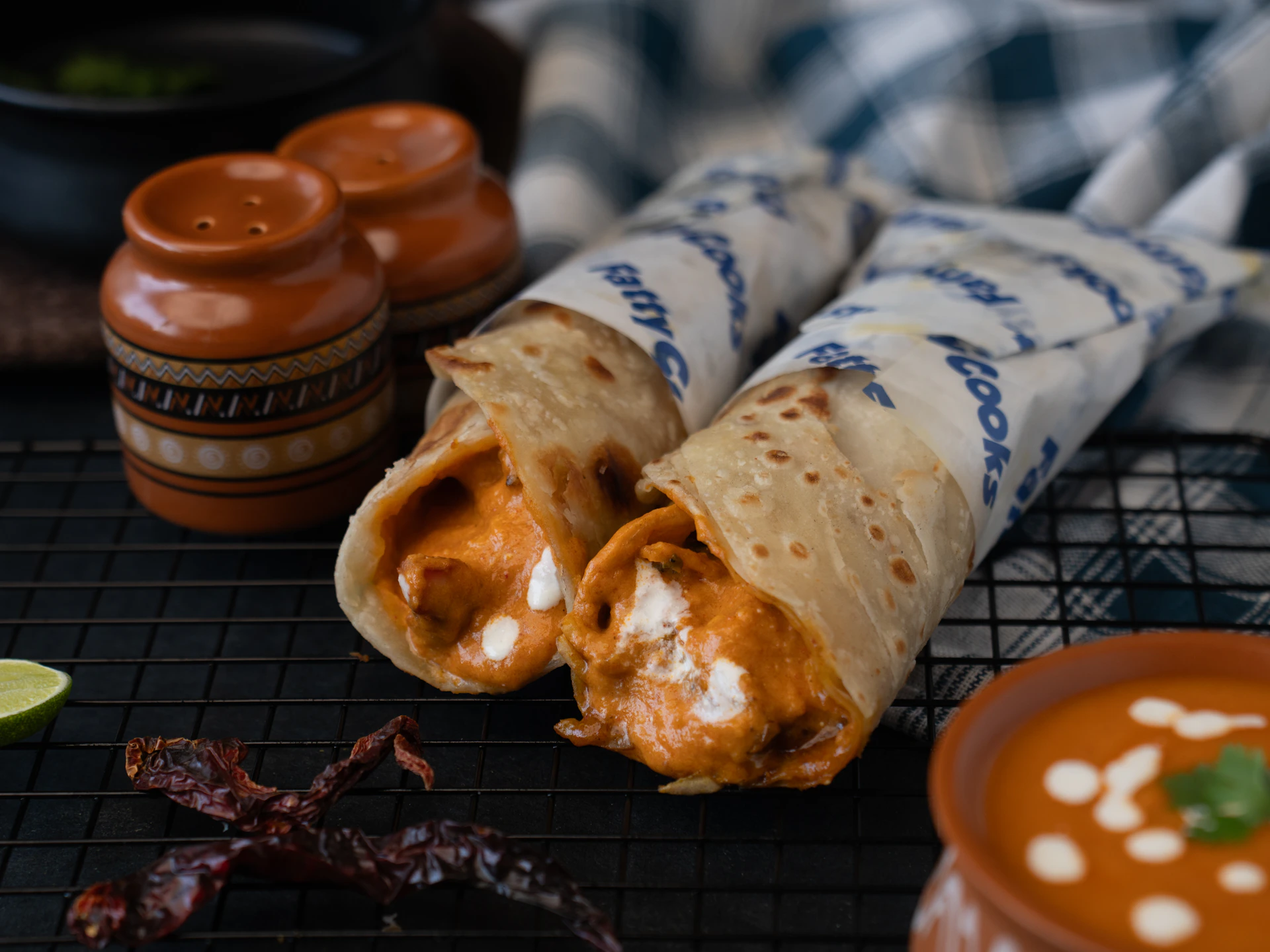 Two delicious wraps filled with creamy sauce.