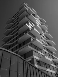 Modern building with unique geometric balconies against sky