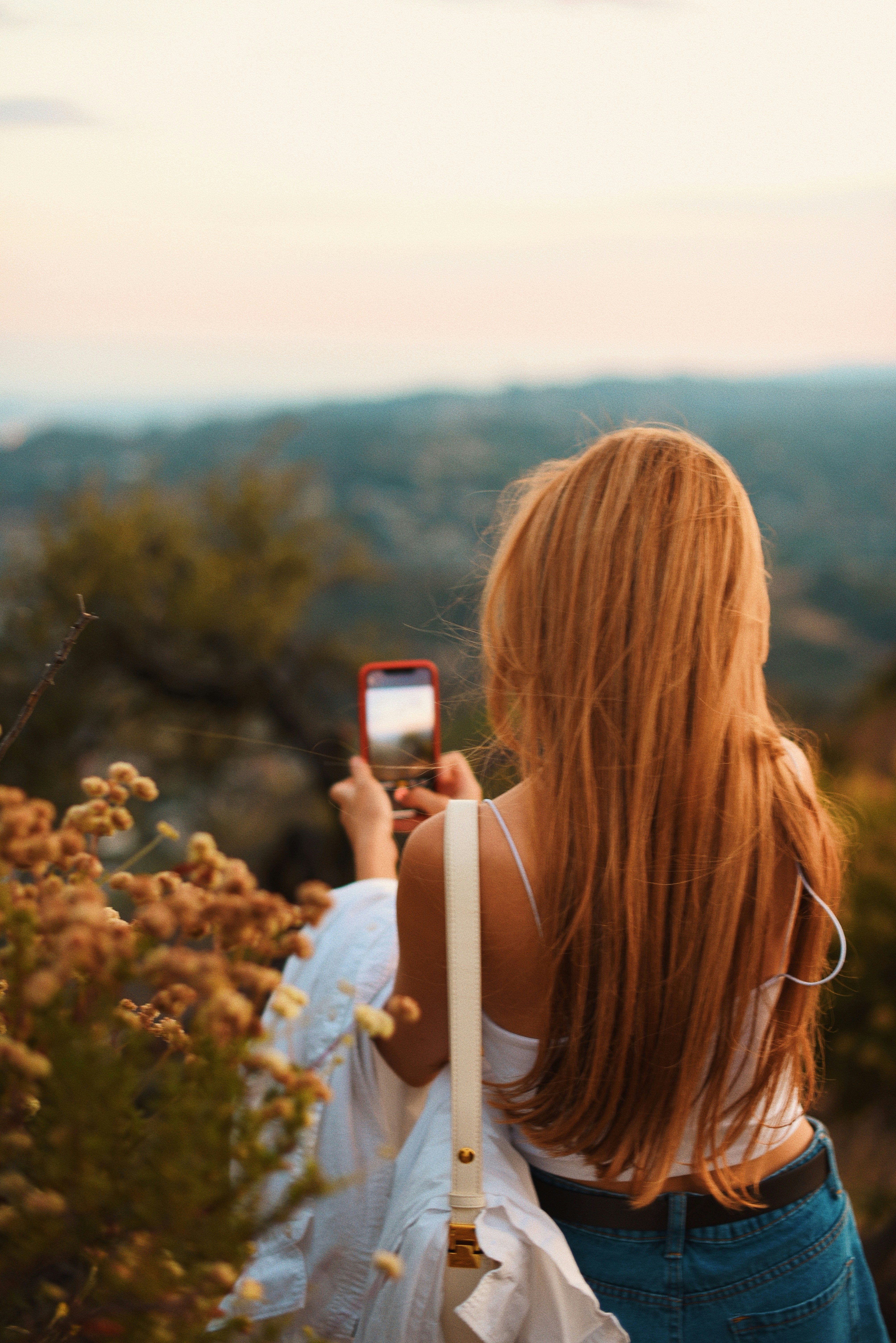 Woman taking a picture with her phone