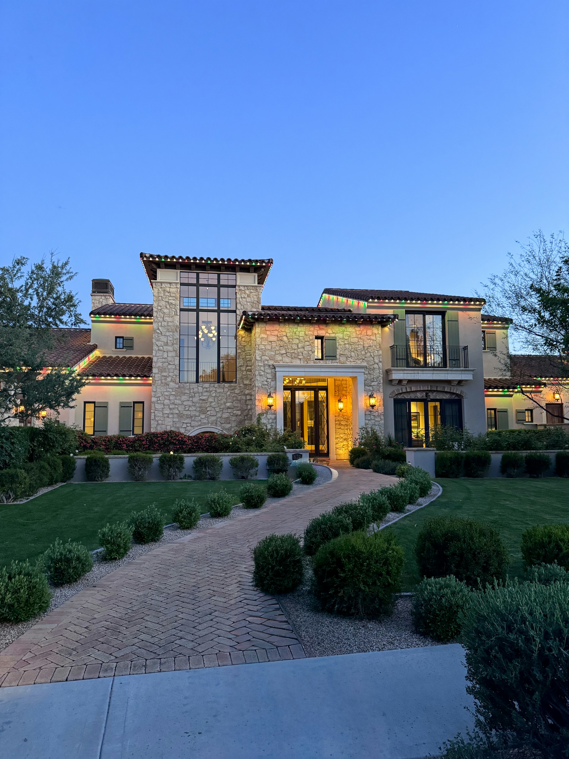 Modern luxury home with manicured lawn and driveway