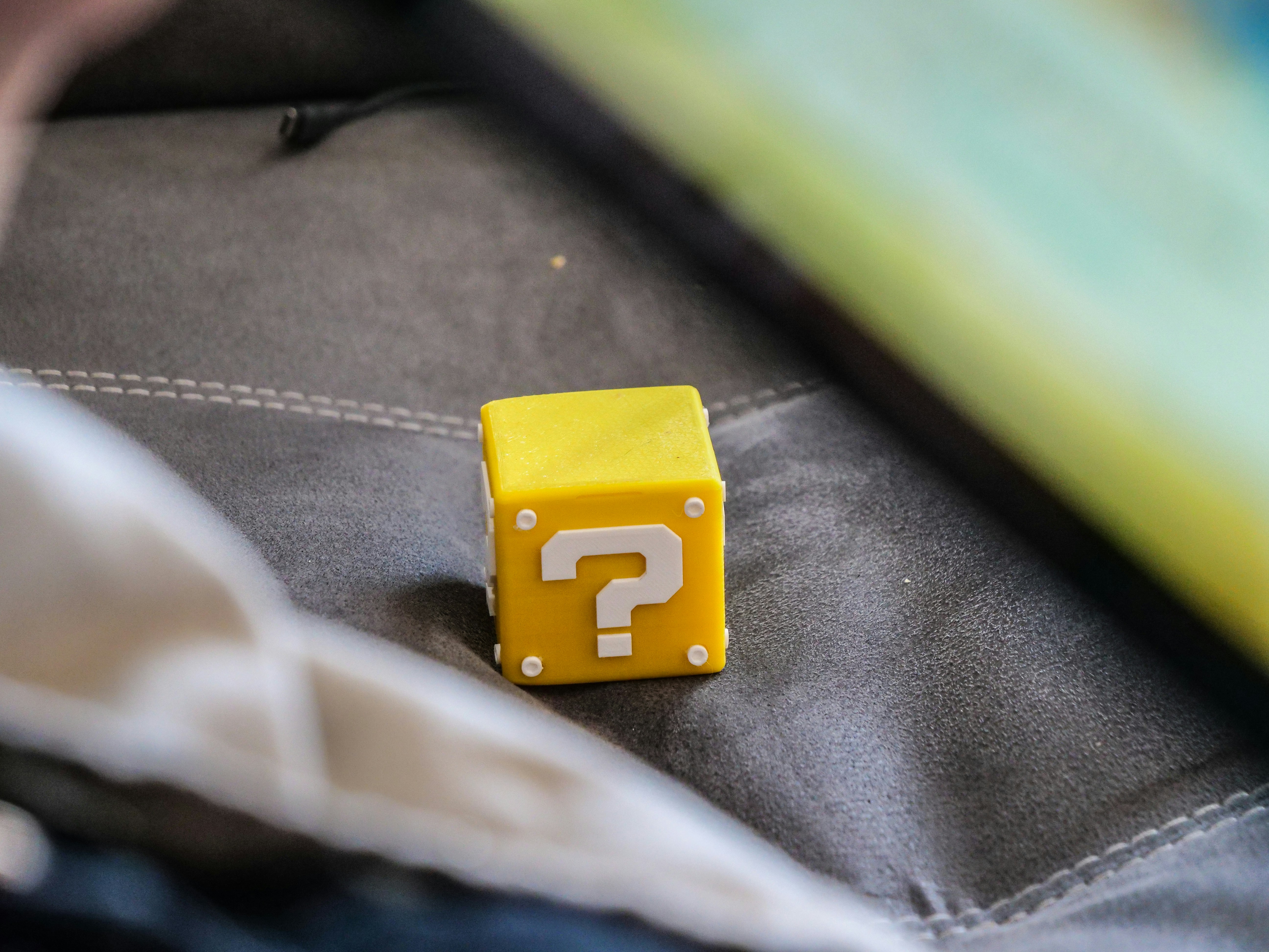 Yellow question mark block from super mario on couch