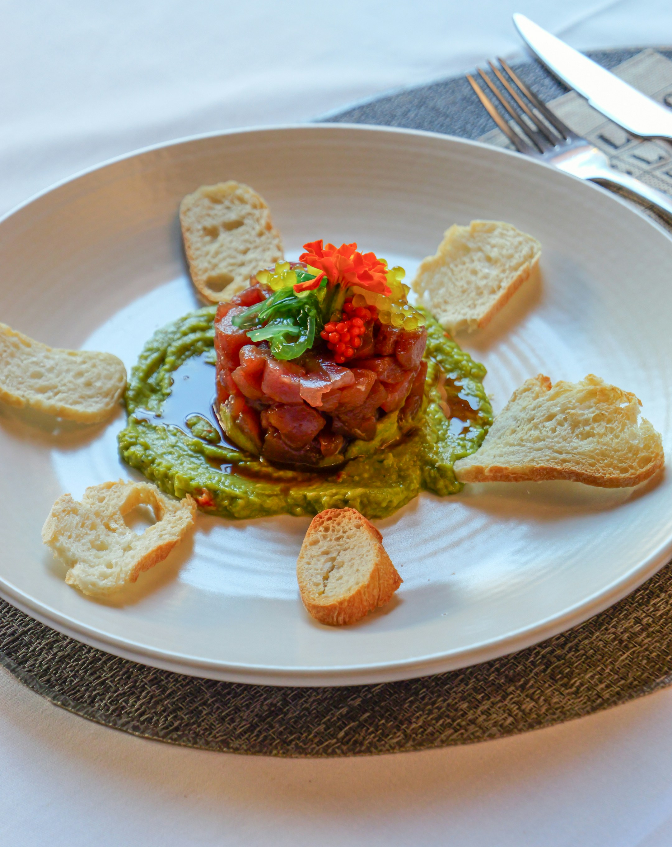 Tuna tartare with avocado and toast points of bread