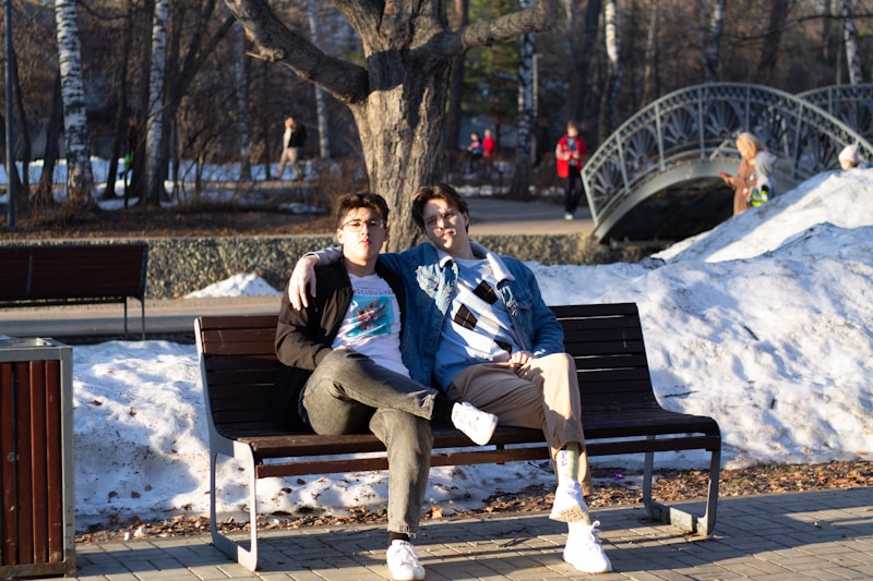 Gay couple on winter bench