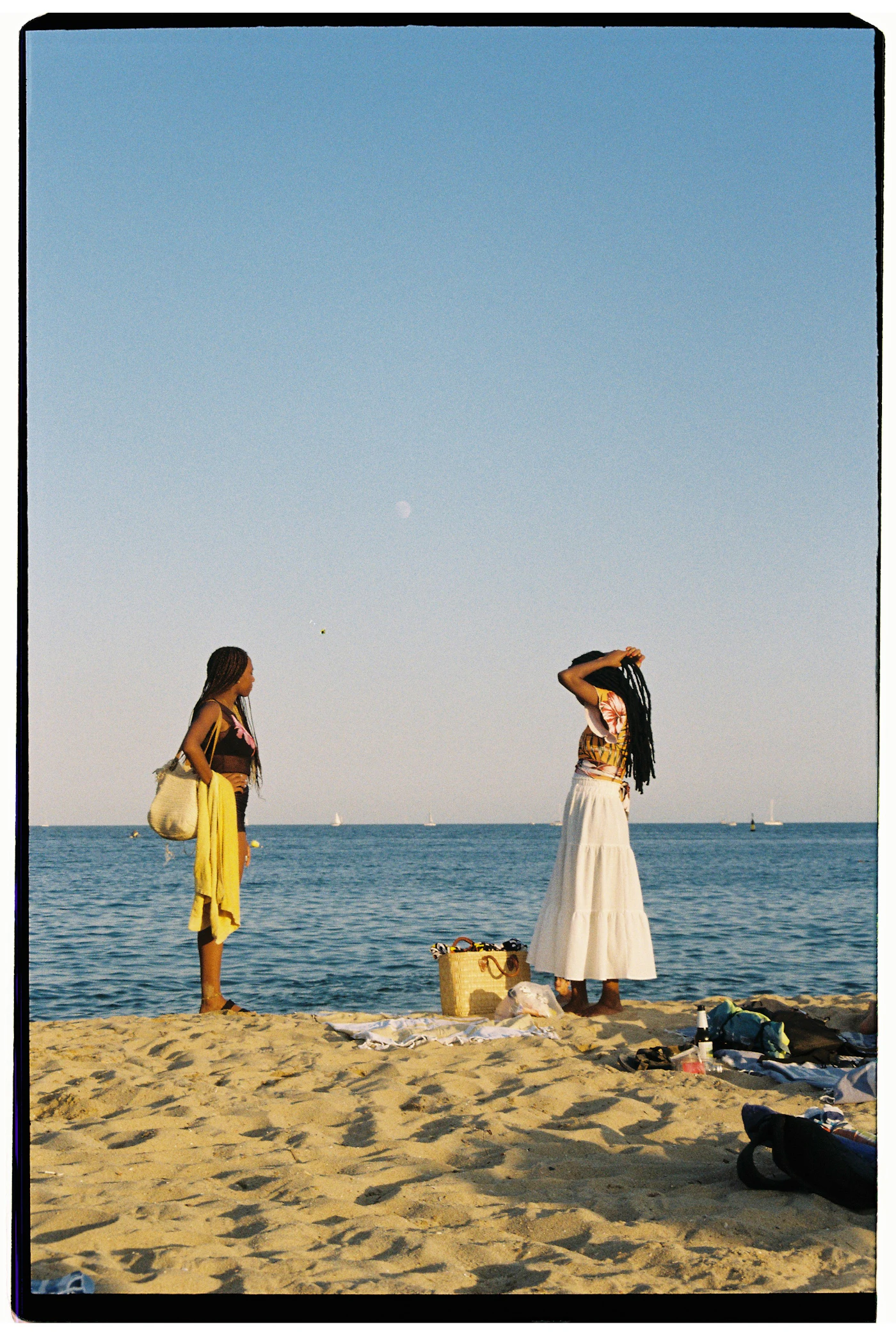 Two adults standing at the shore