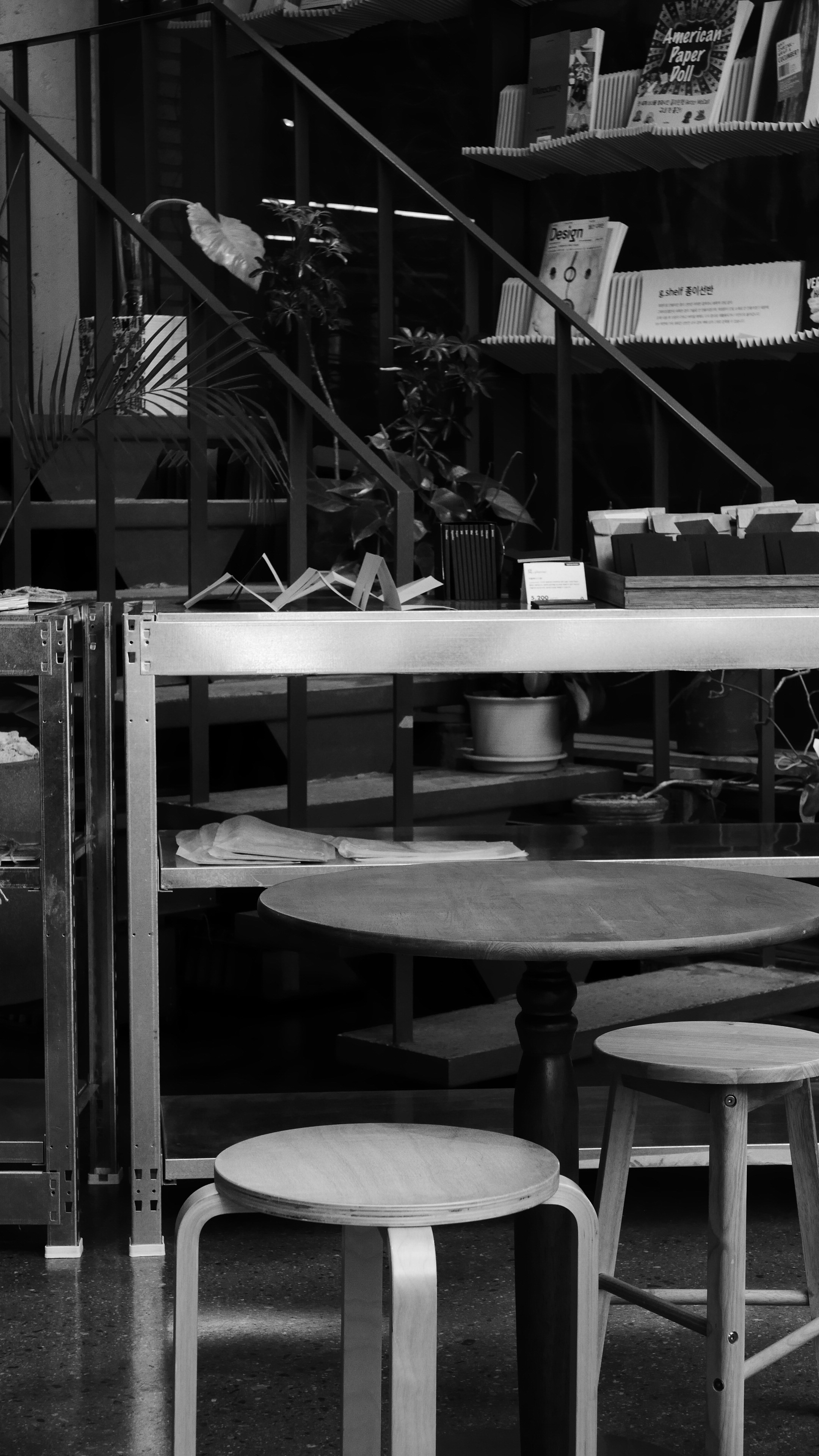 Two stools and table in a modern room.