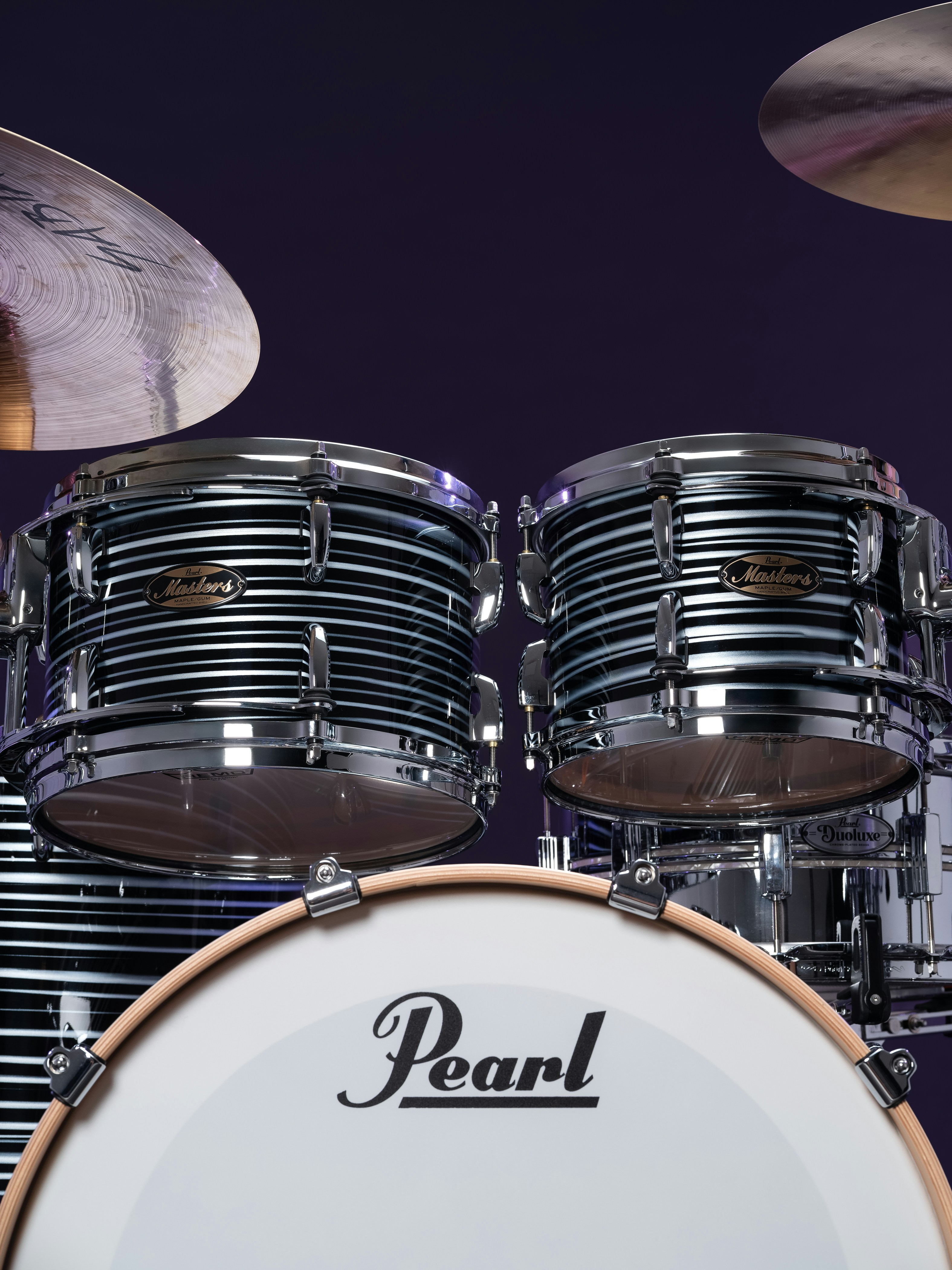 Close-up of a pearl drum kit with cymbals