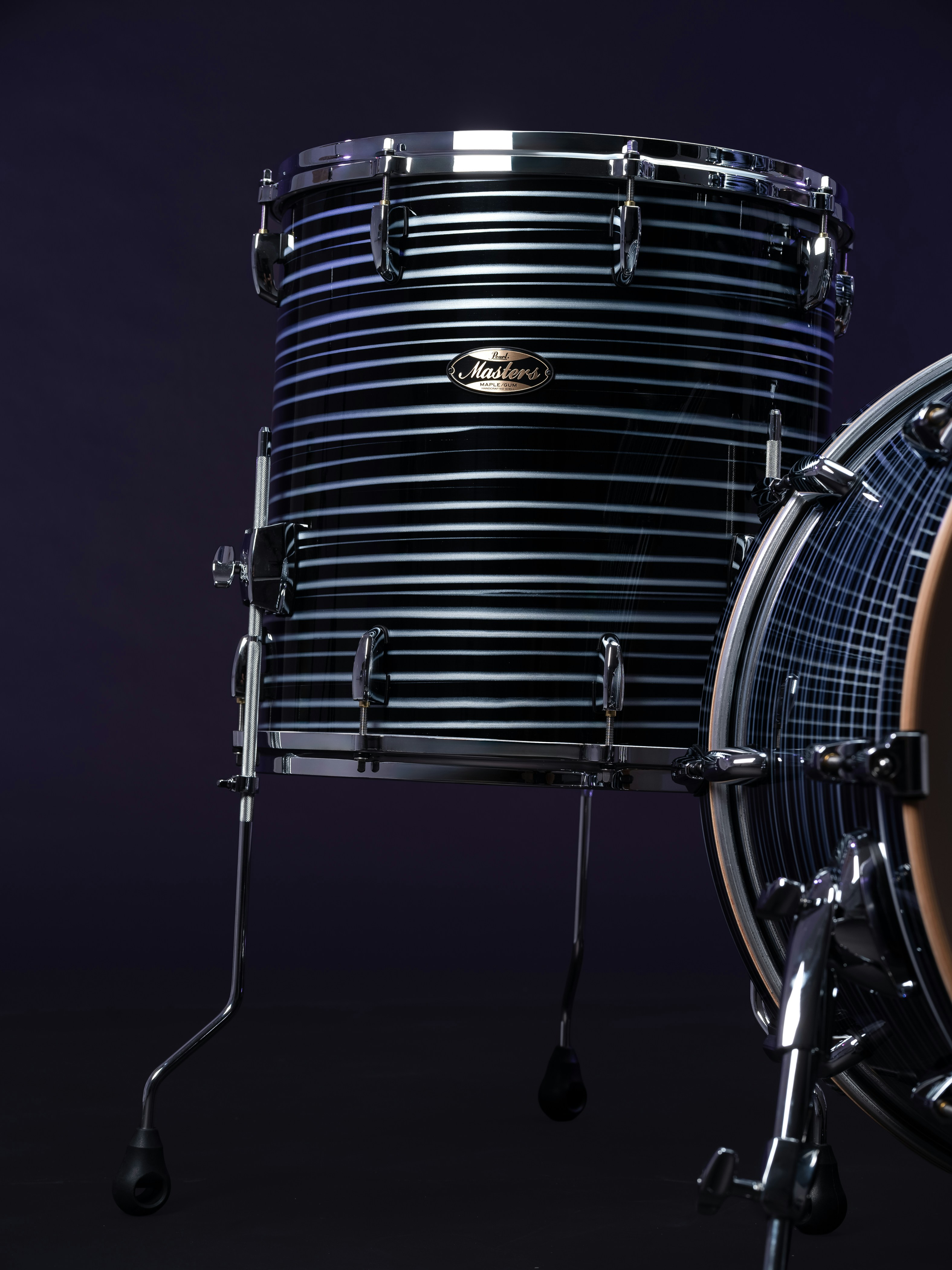 A close-up of a drum with a dark background