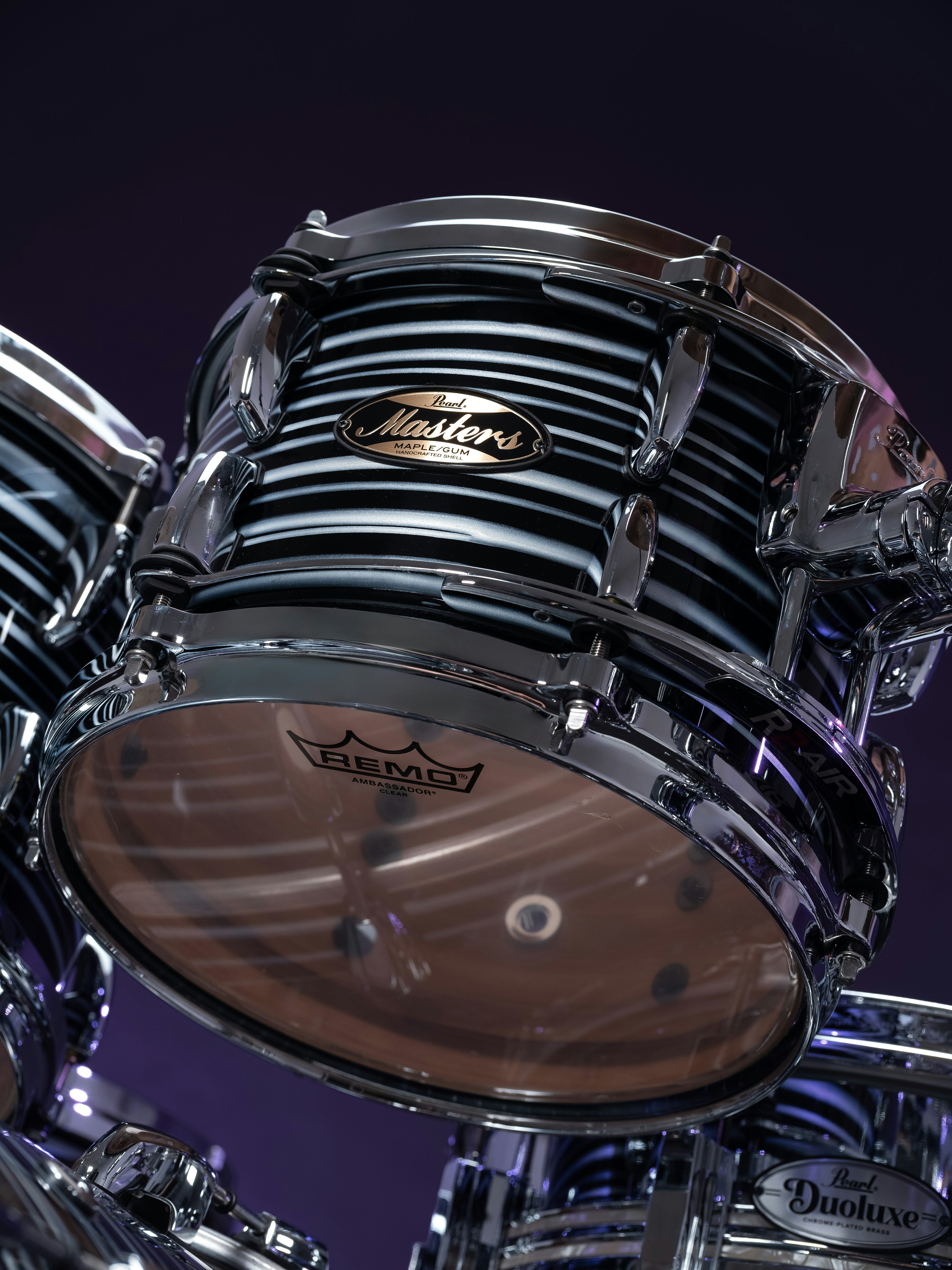 Close-up of a black and white striped drum set