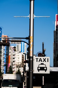 Taxi sign on a street light pole