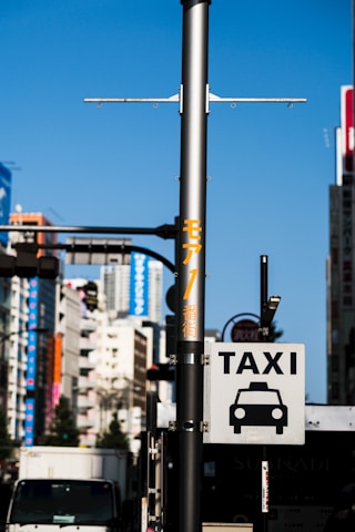 Taxi sign on a street light pole