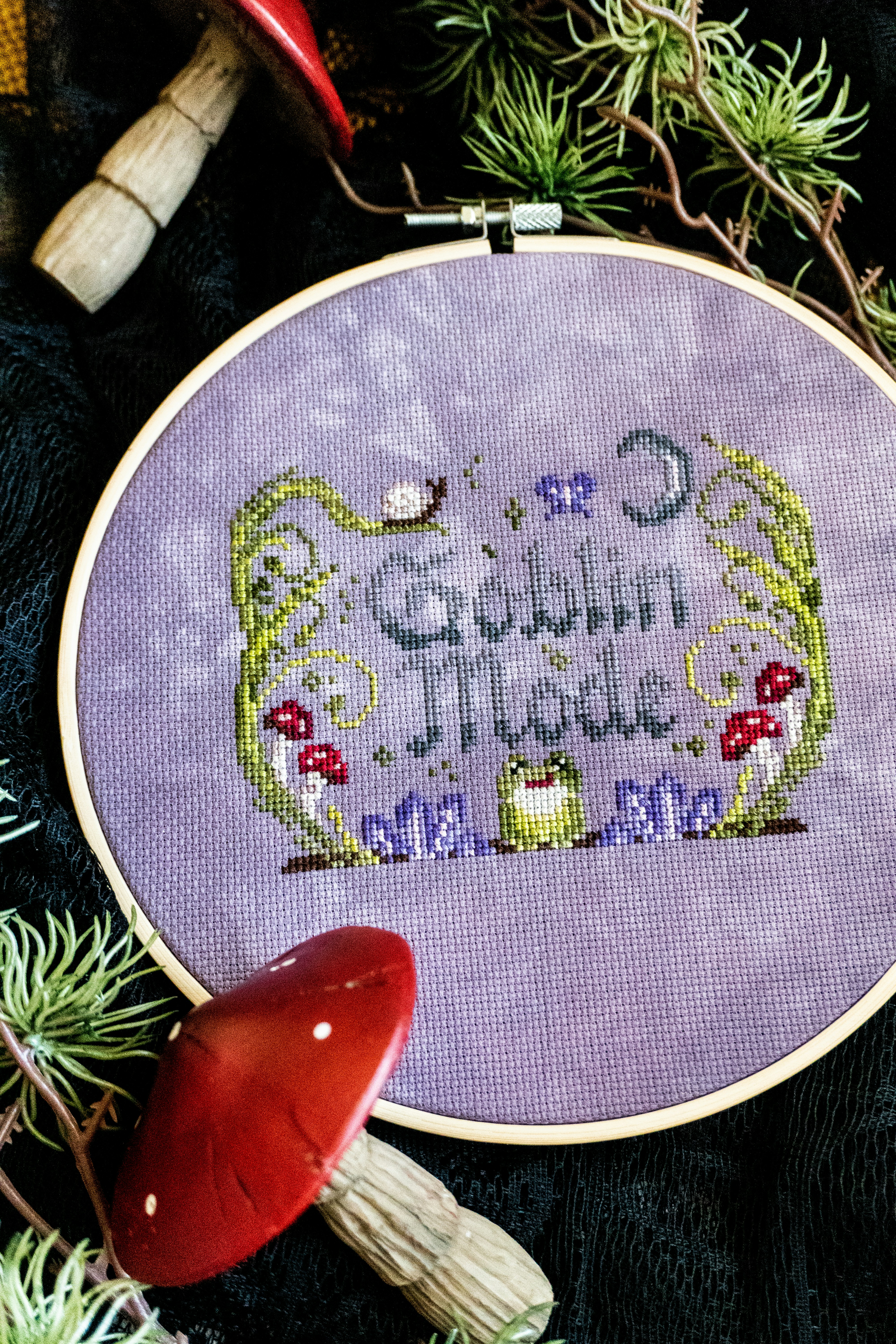 Cross-stitch with "goblin mode" text and forest elements.