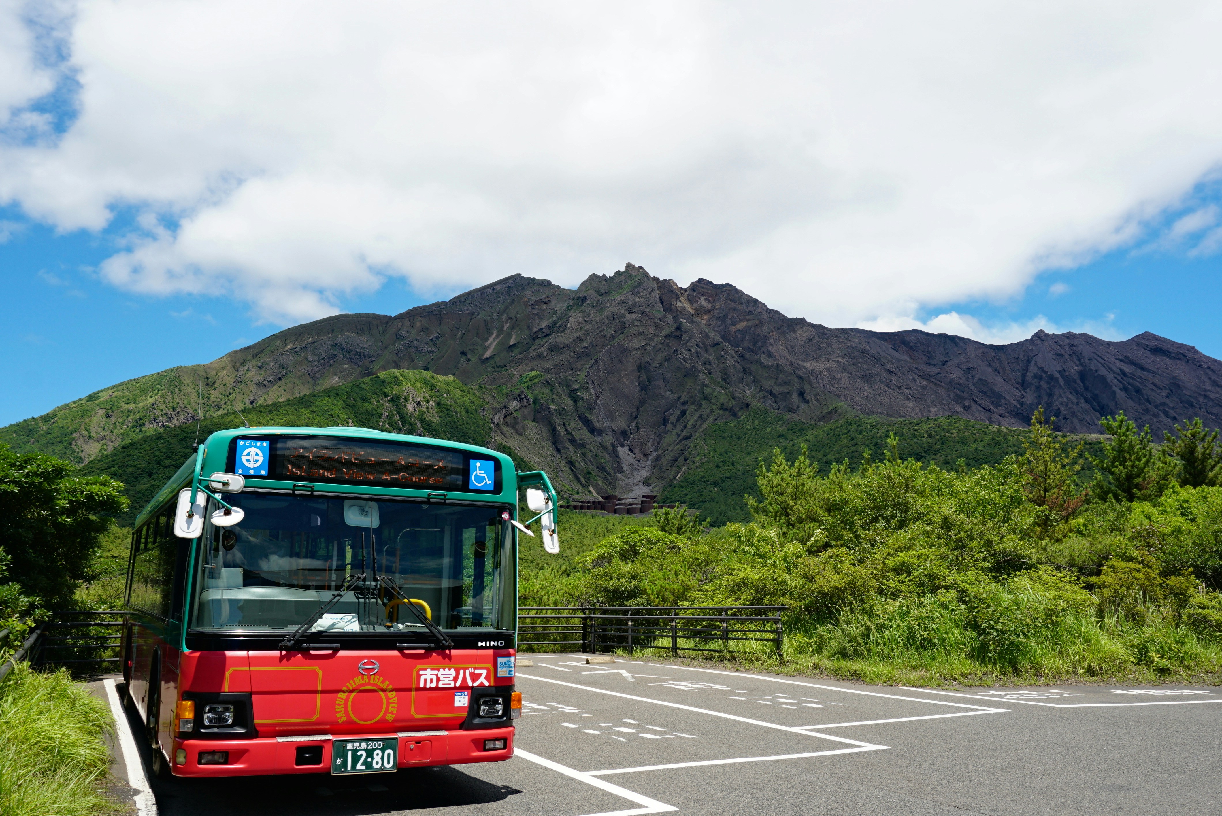 Bus parked with volcanic mountain backdrop