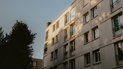 Modern apartment building with trees and sky