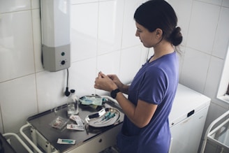 Nurse preparing medical supplies on a tray