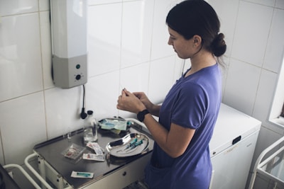 Nurse preparing medical supplies on a tray