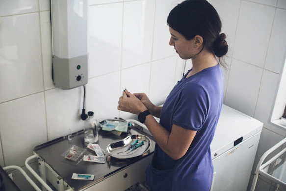 Nurse preparing medical supplies on a tray