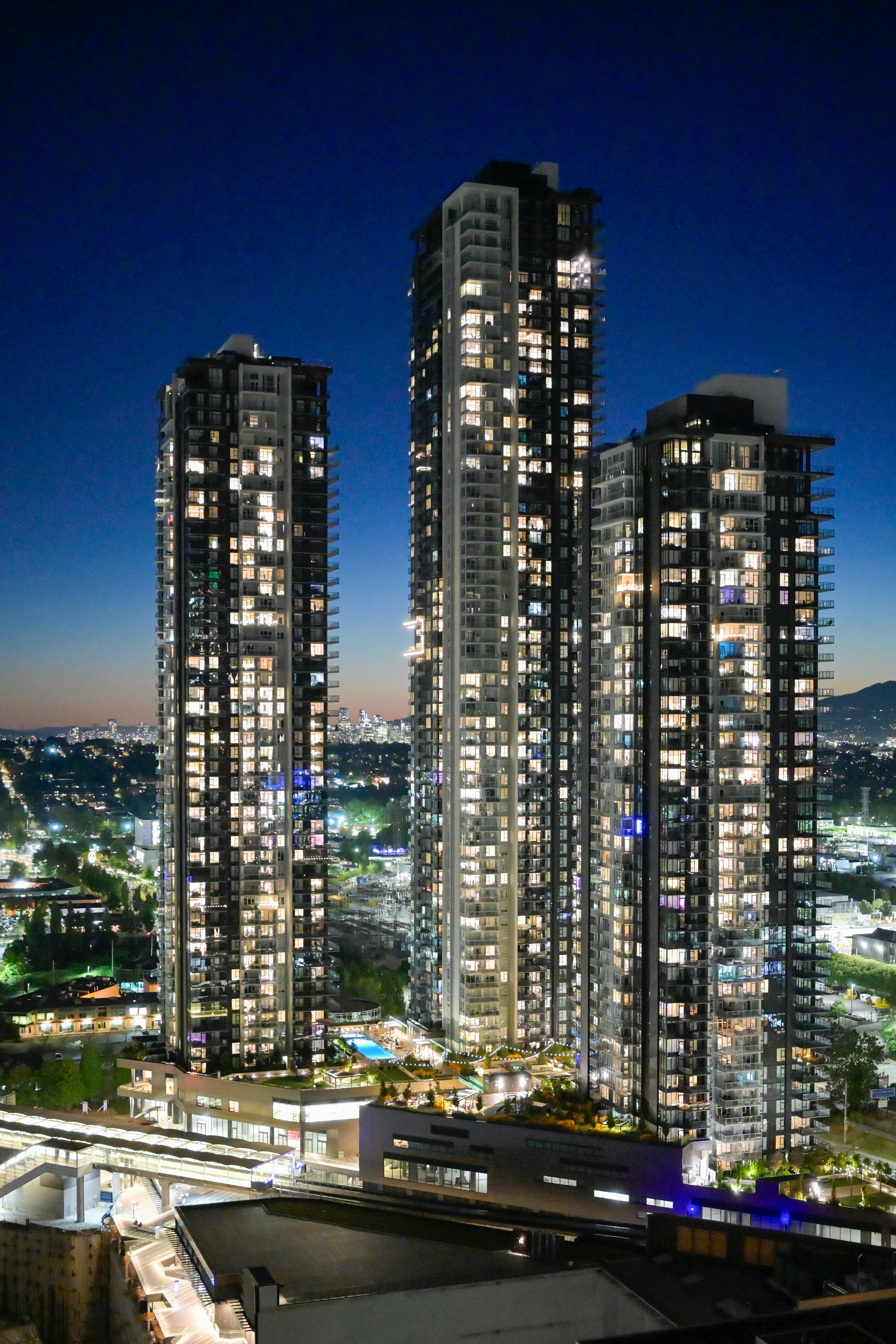 Modern high-rise buildings illuminated at night