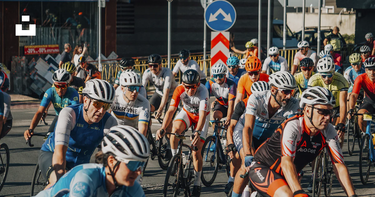Peleton Helmet Racing Cyclists racing in a peloton on a sunny day. photo – Free Summer Image ...