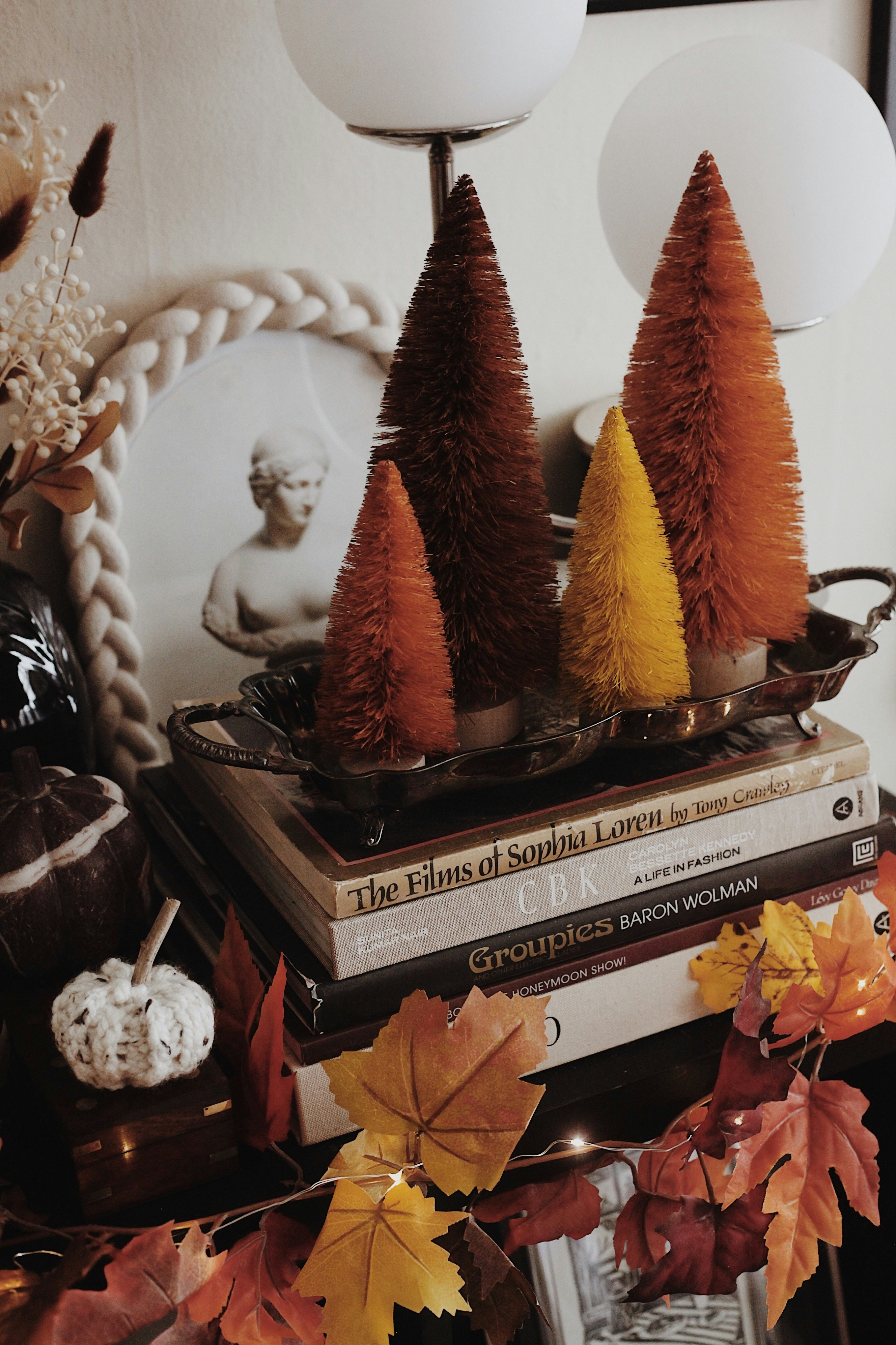 Autumn decorations with bottle brush trees and pumpkins