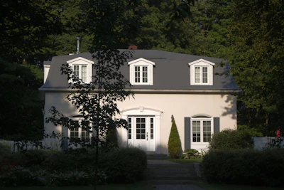 A charming house with dormer windows and shutters
