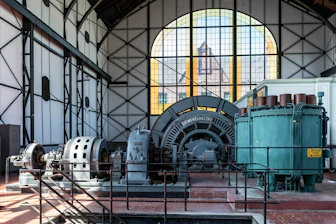 Large industrial machinery inside a historic building