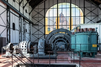 Large industrial machinery inside a historic building
