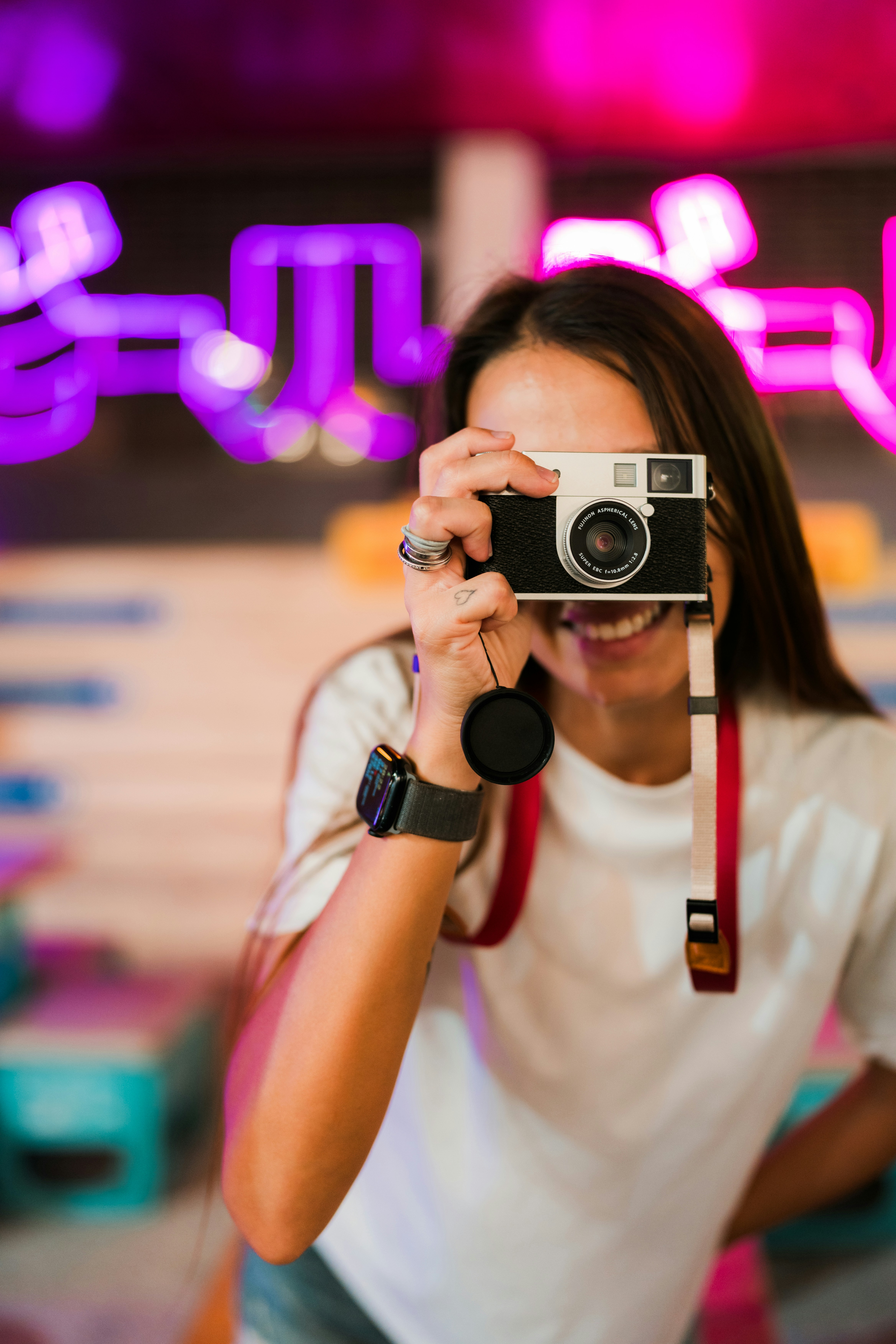 Woman holding vintage camera to take a picture