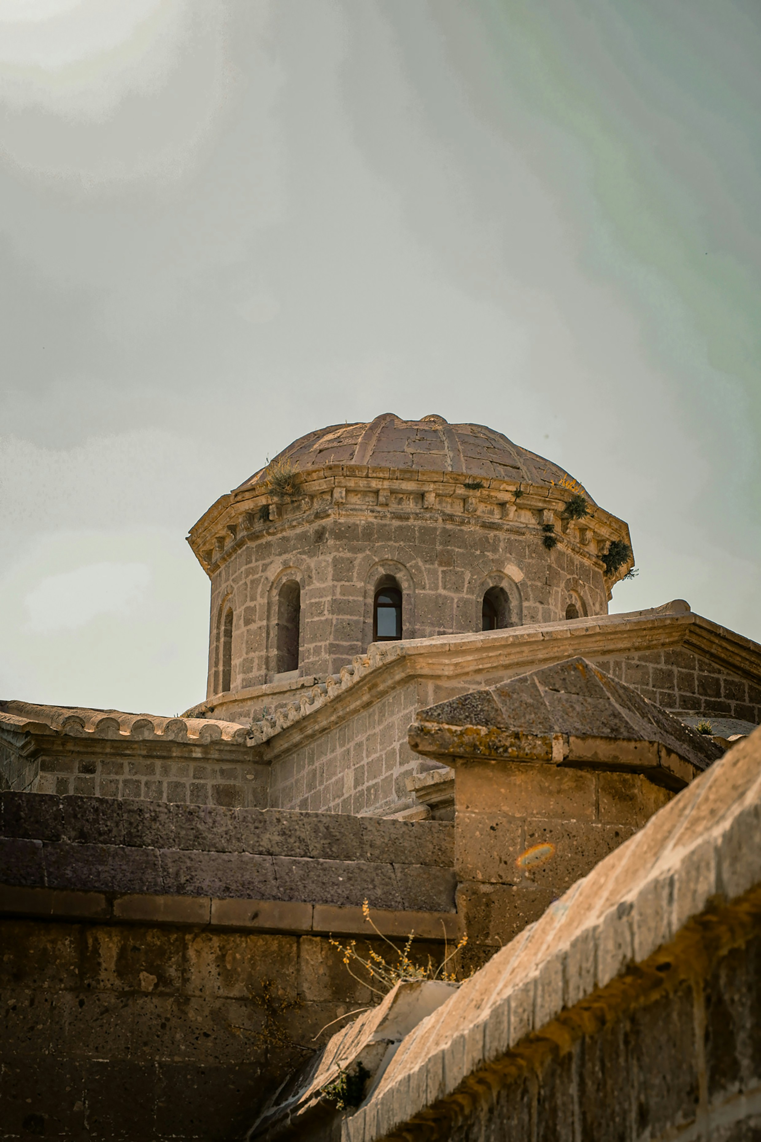 Stone dome of an ancient building against a cloudy sky