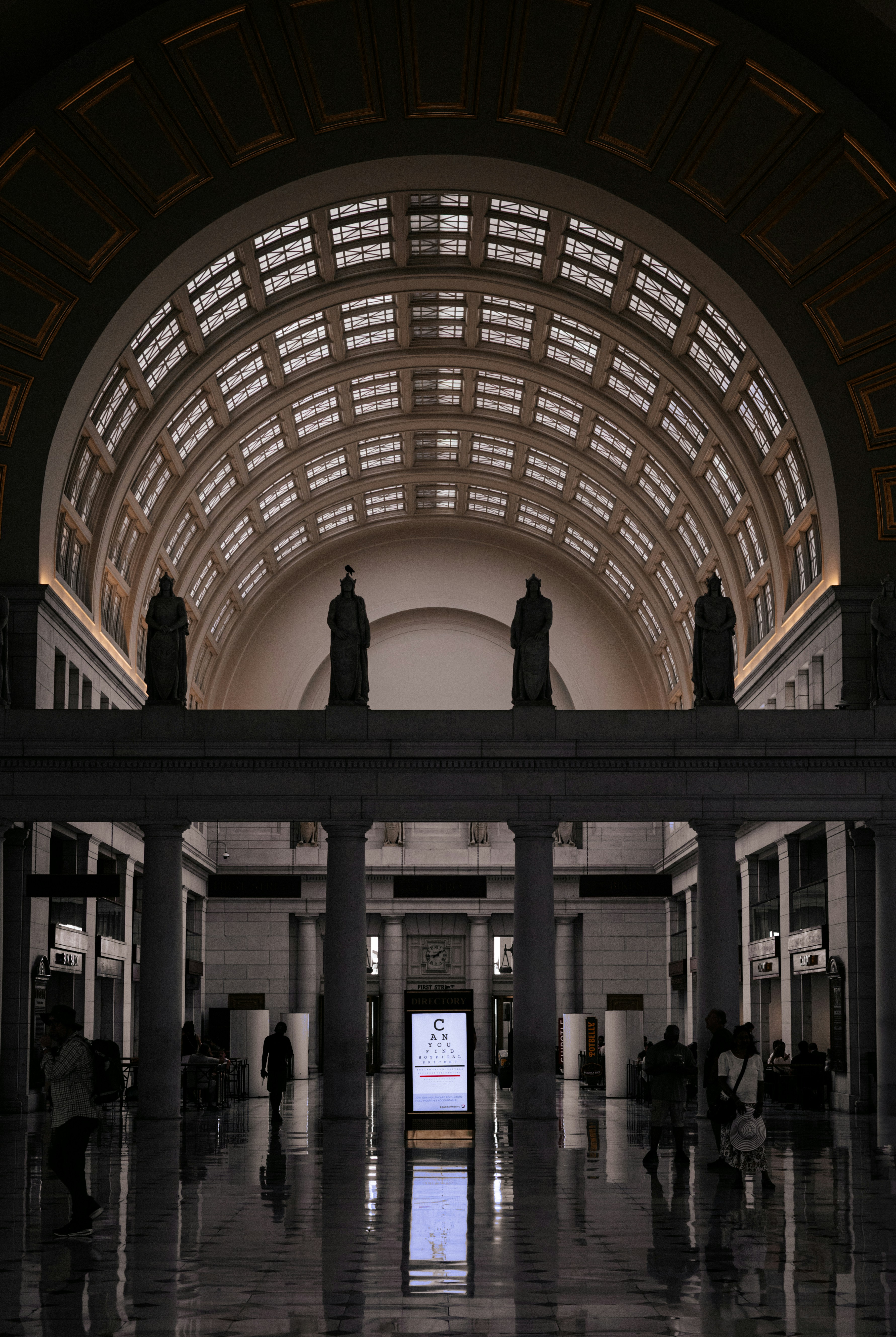 Grand interior with arched ceiling and statues