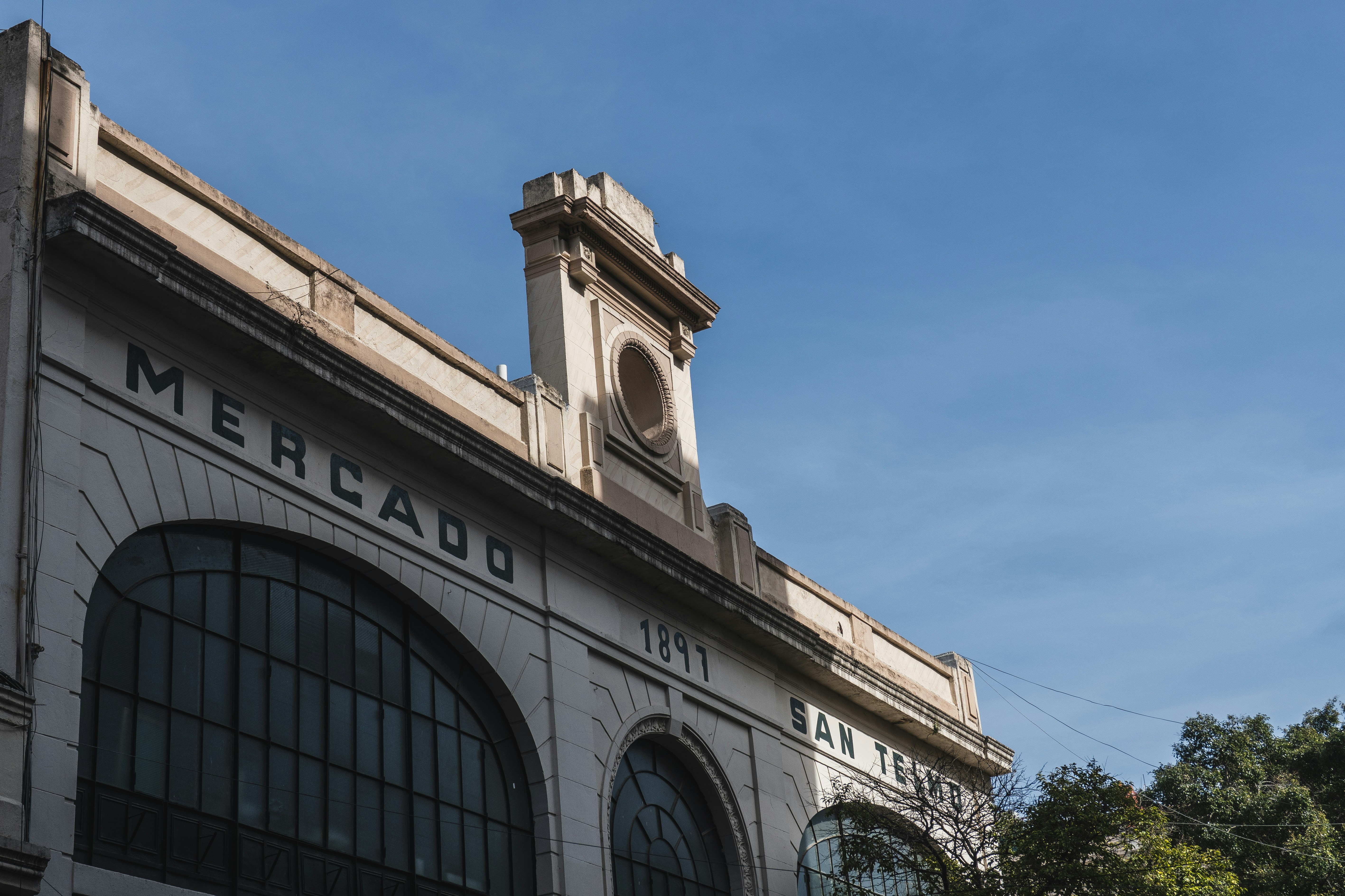 Mercado building facade with large arched windows