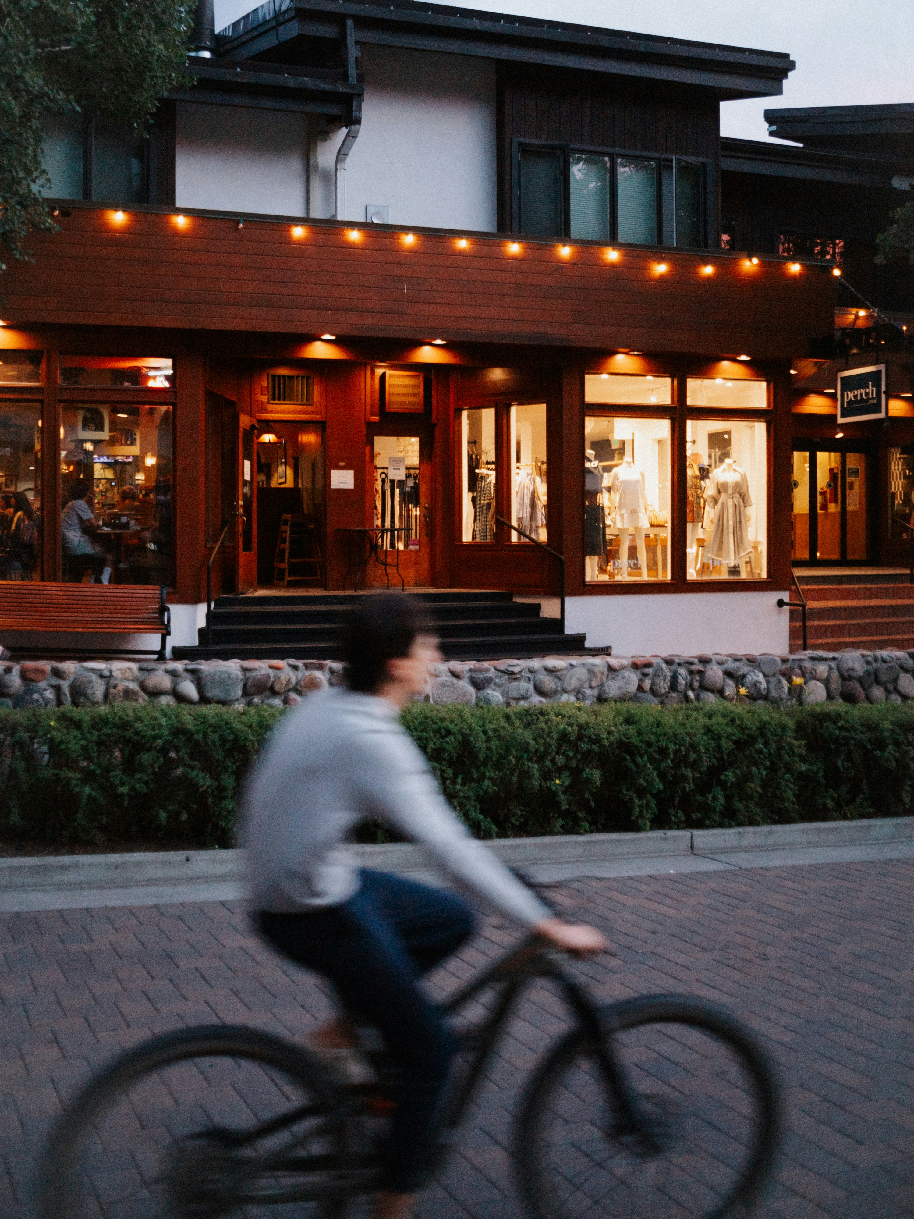 Image of a person speeding past a building