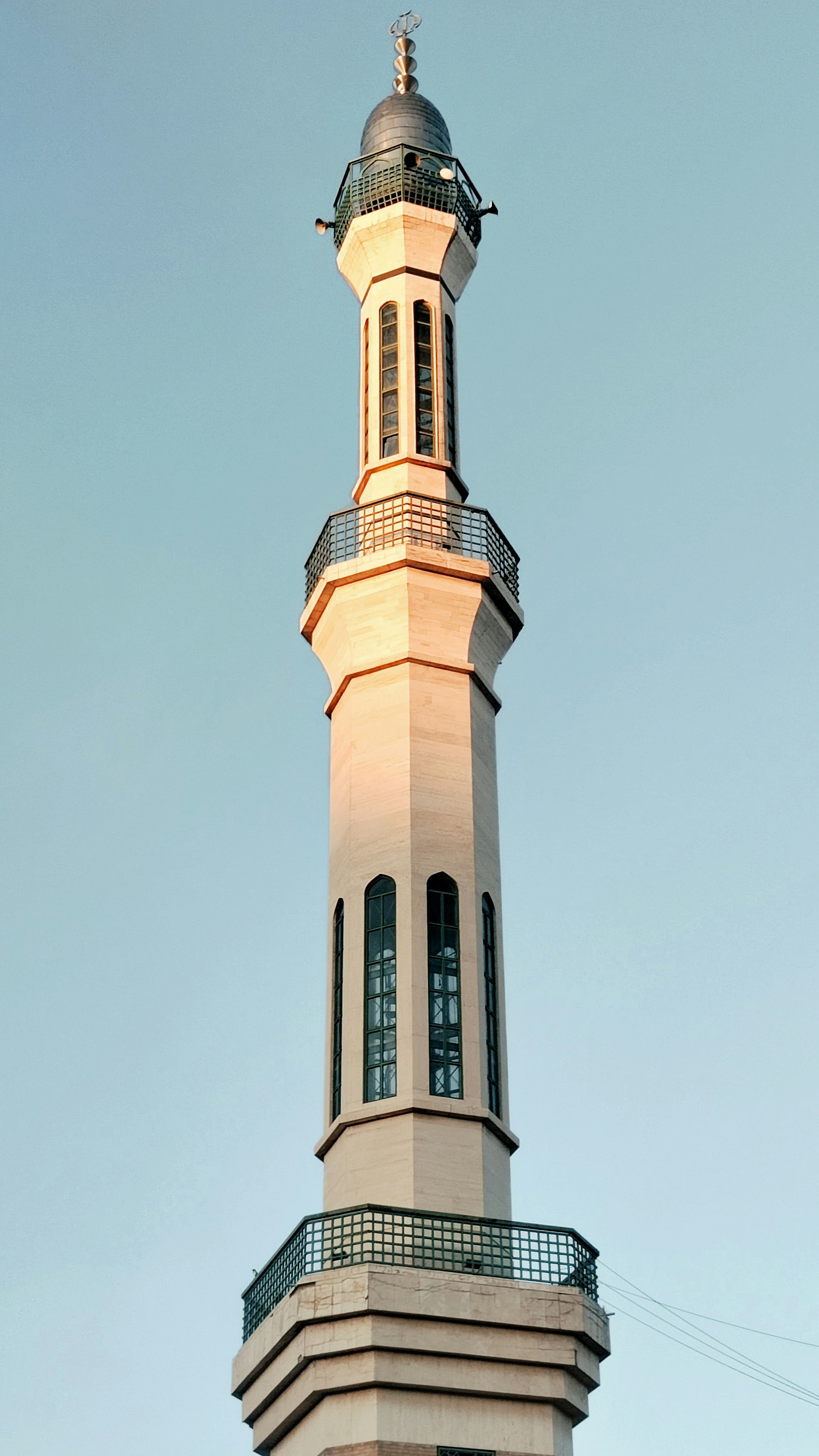 Tall minaret of a mosque against a clear sky