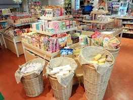 Wicker baskets filled with goods in a well-stocked store.