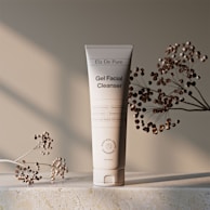 Gel facial cleanser tube with decorative branches.