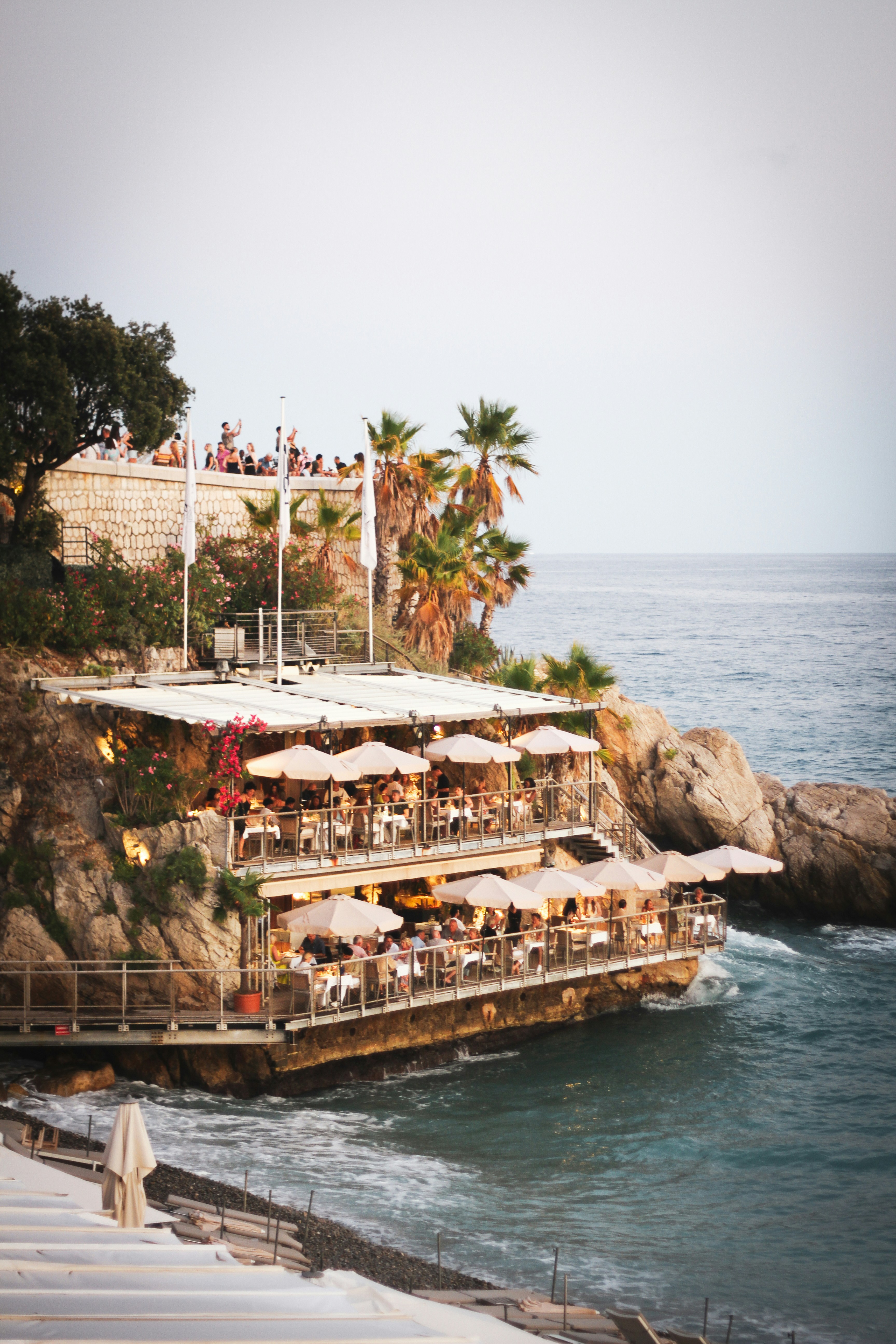 Restaurant with tables on a cliff overlooking the sea