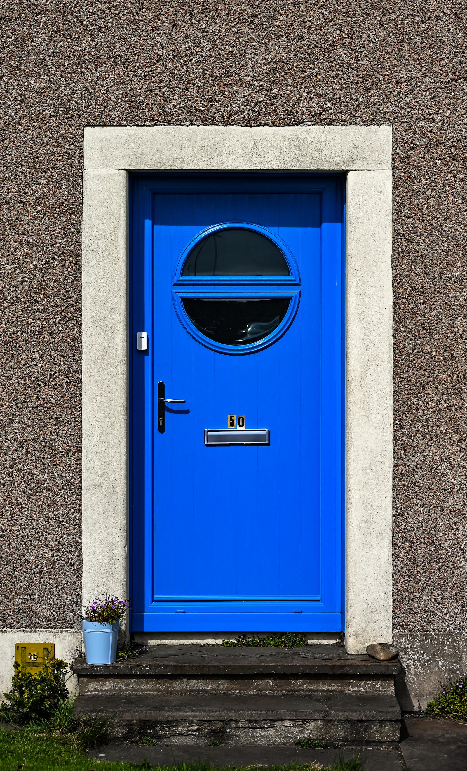Blue door with brass hardware, locks replaced