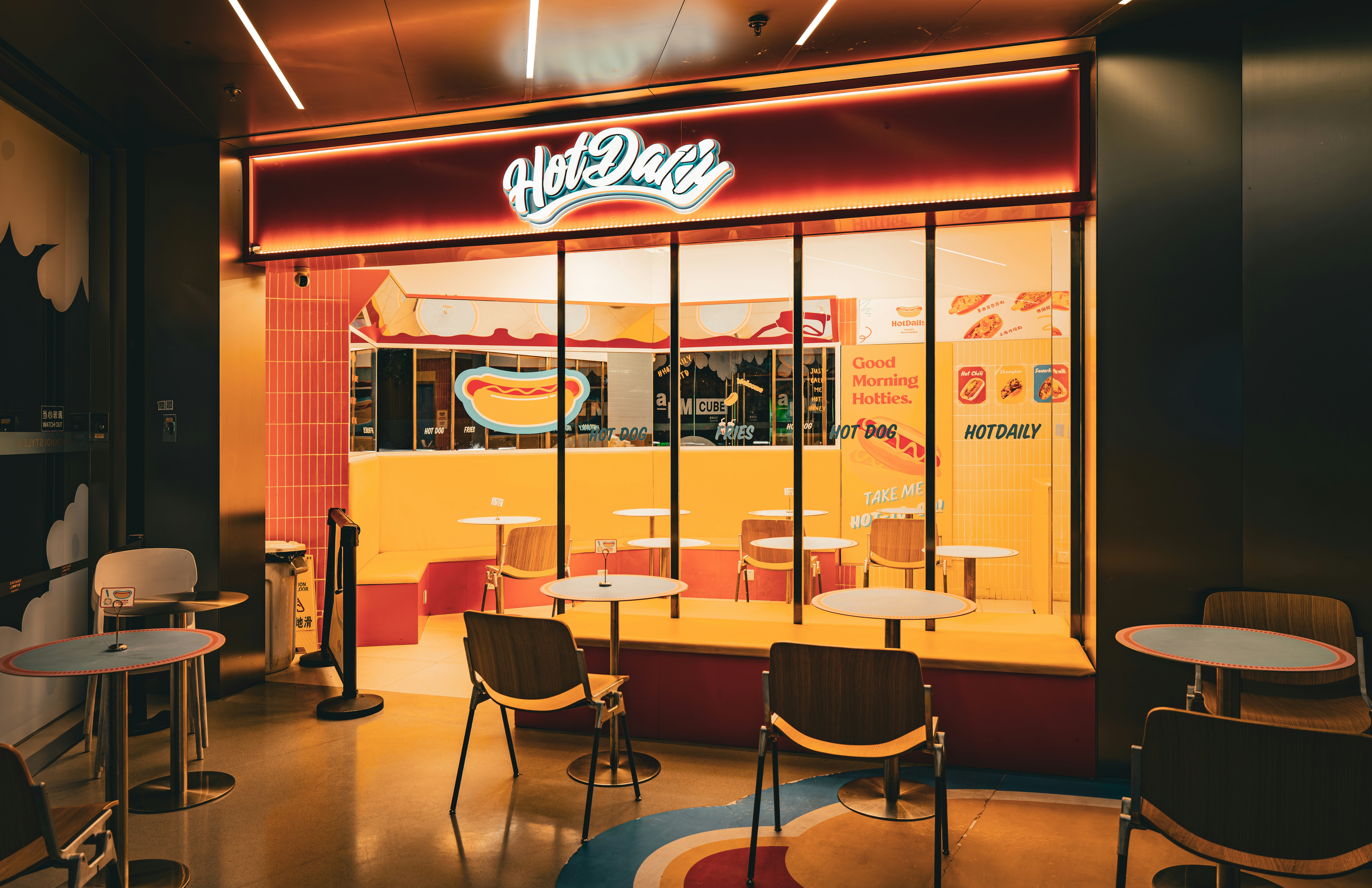 Hot dog stand with tables and chairs inside