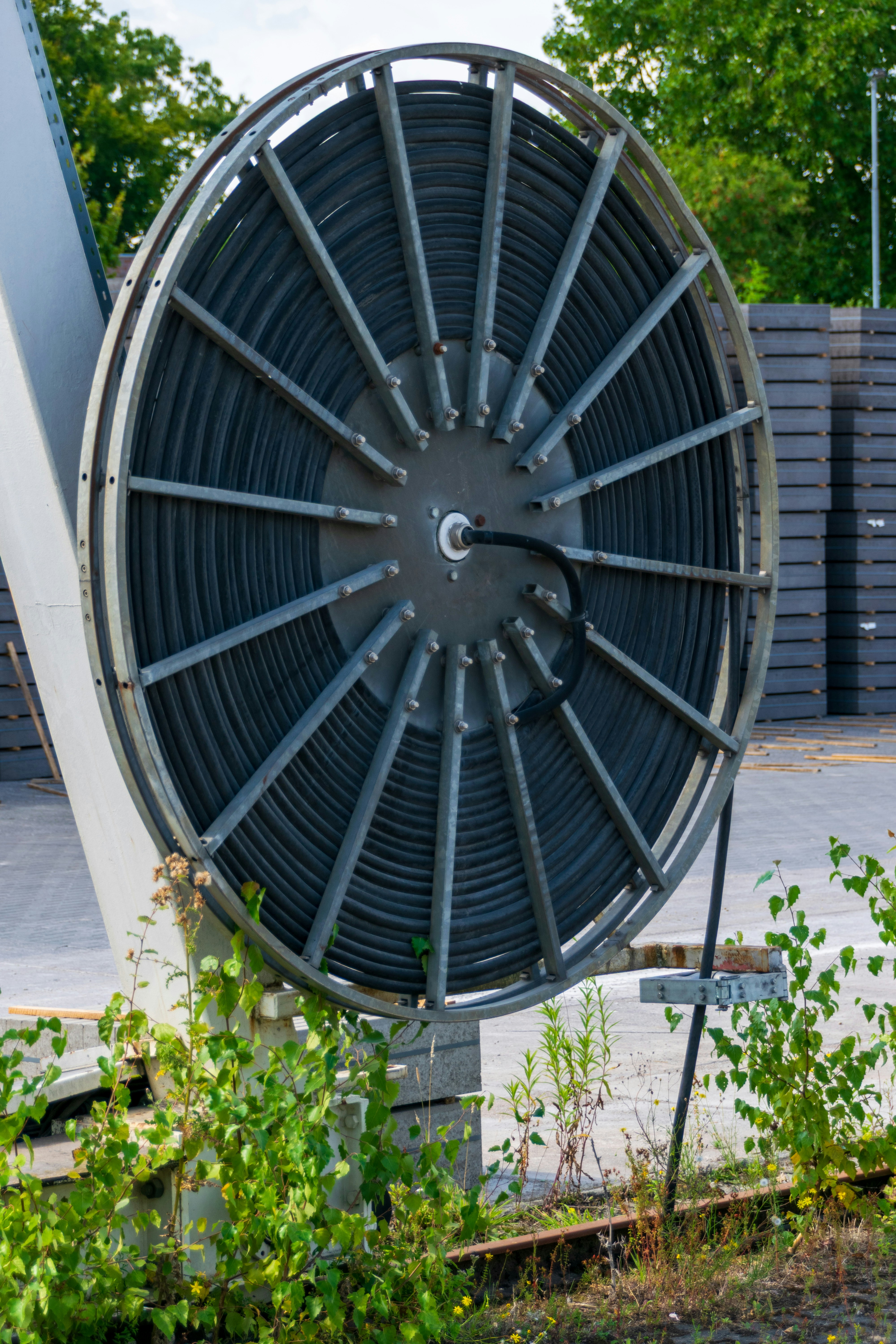 Large industrial reel with coiled black cable