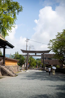 Traditional wooden torii gate on a sunny day