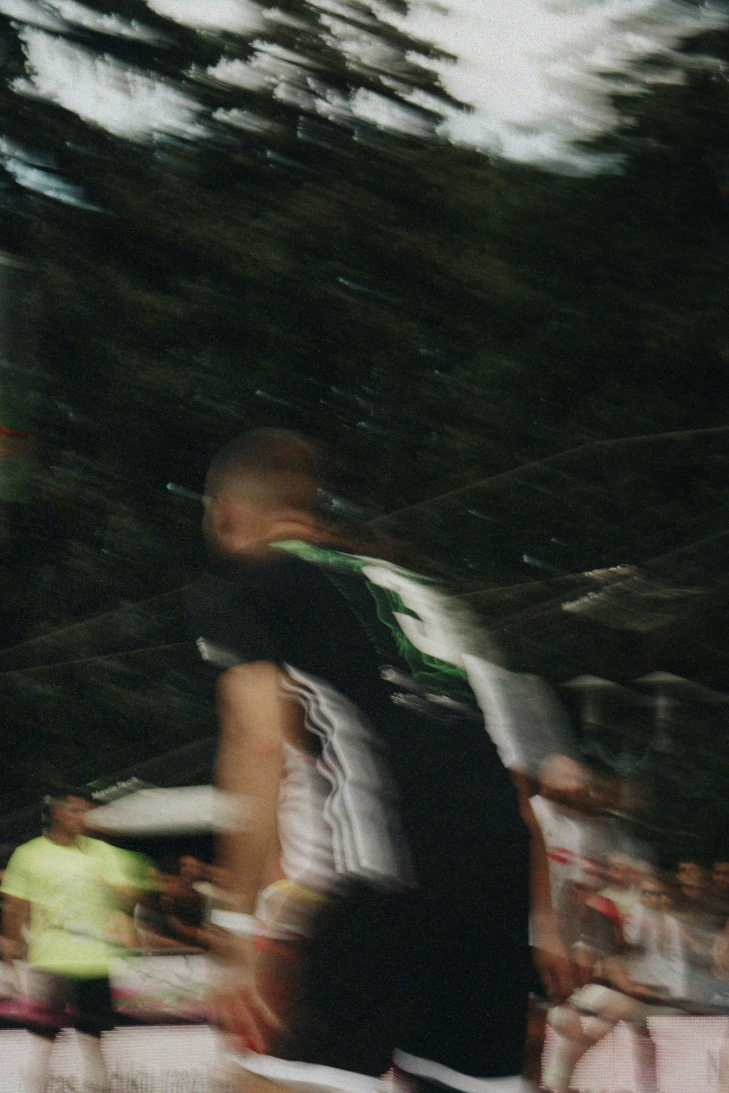 A blurred action shot of a man playing sports